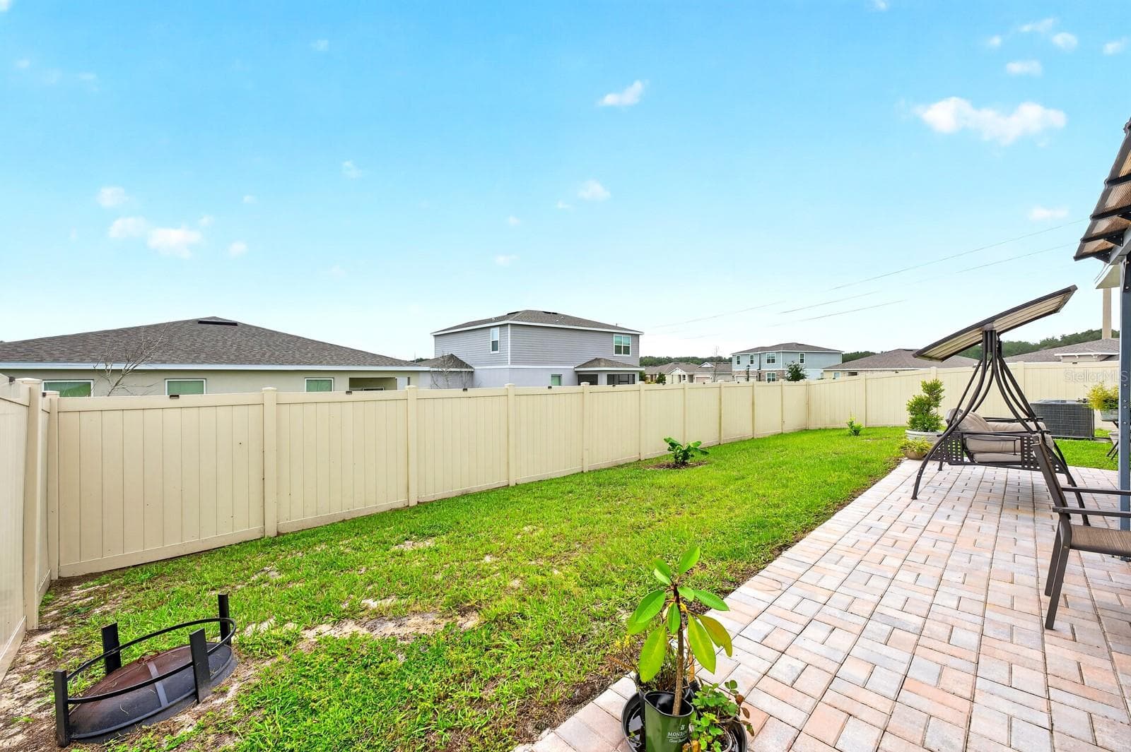 The generous backyard offers endless possibilities for entertaining and enjoying the outdoors. - 33384 COUNTRY HOUSE DR, SORRENTO
