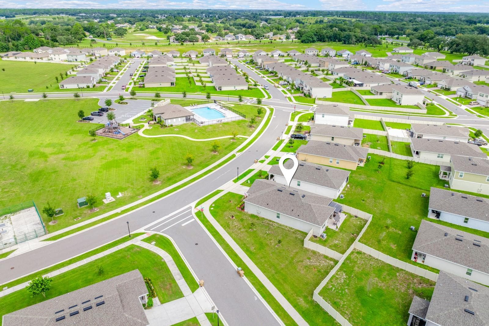Aerial view of the home and community. - 33384 COUNTRY HOUSE DR, SORRENTO