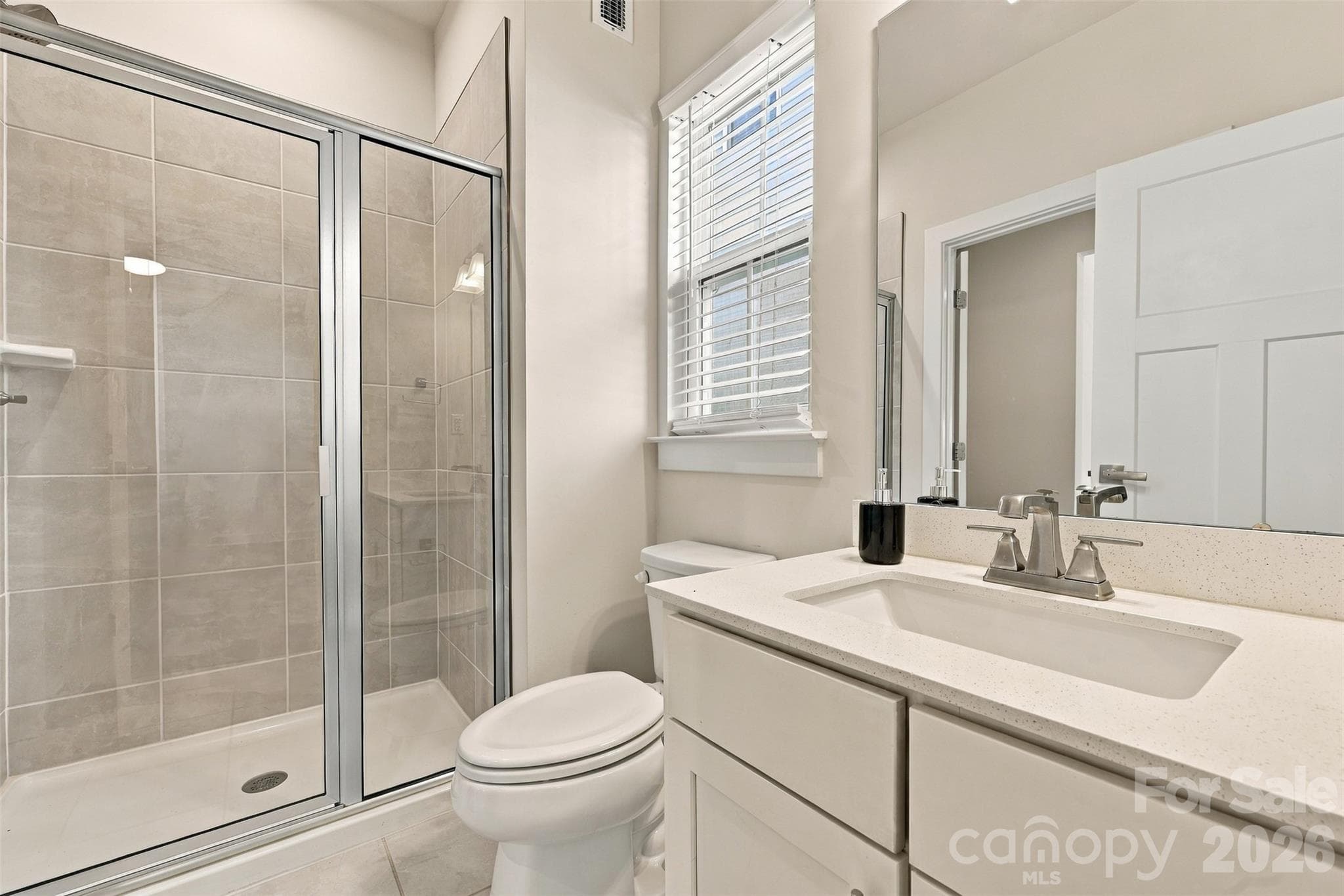 Guest bathroom with upgraded walk-in shower on the main level - Mooresville