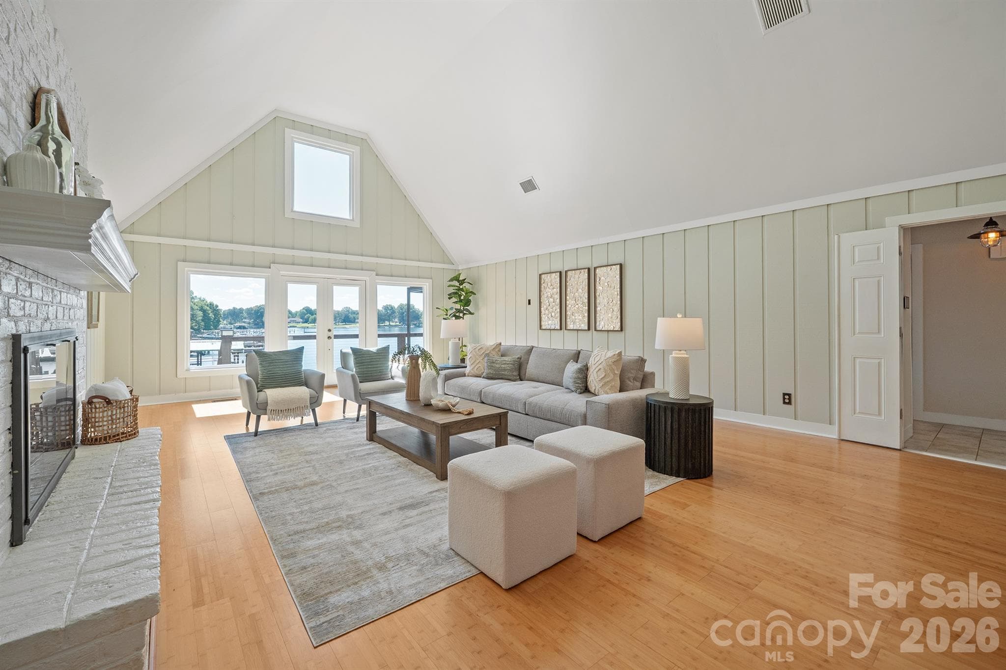 Tremendous Great room with vaulted ceilings and showcasing the picture windows that enhance the lake views - 20919 Island Forest Drive, Cornelius