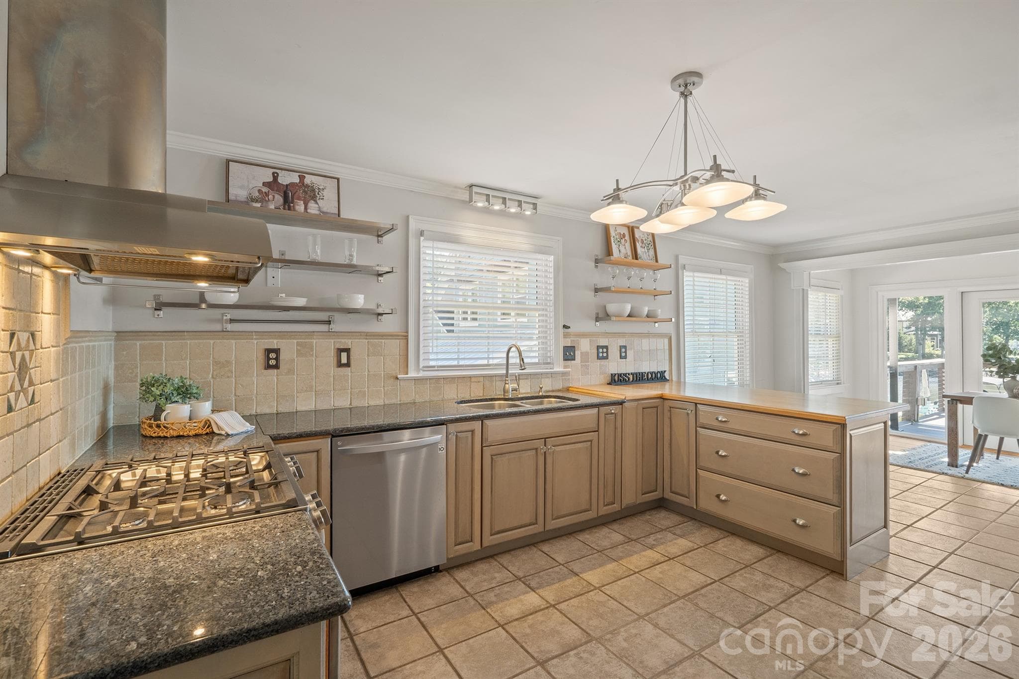 Kitchen has stainless appliances and greywashed cabinetry - 20919 Island Forest Drive, Cornelius