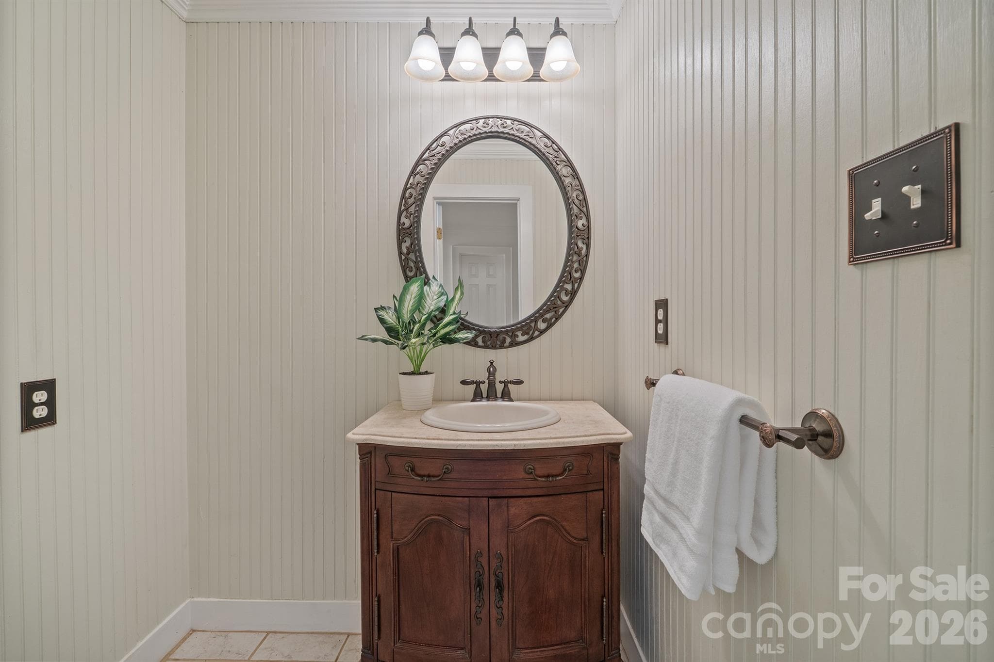 Powder bath has shiplap vertical walls and furniture piece vanity - 20919 Island Forest Drive, Cornelius