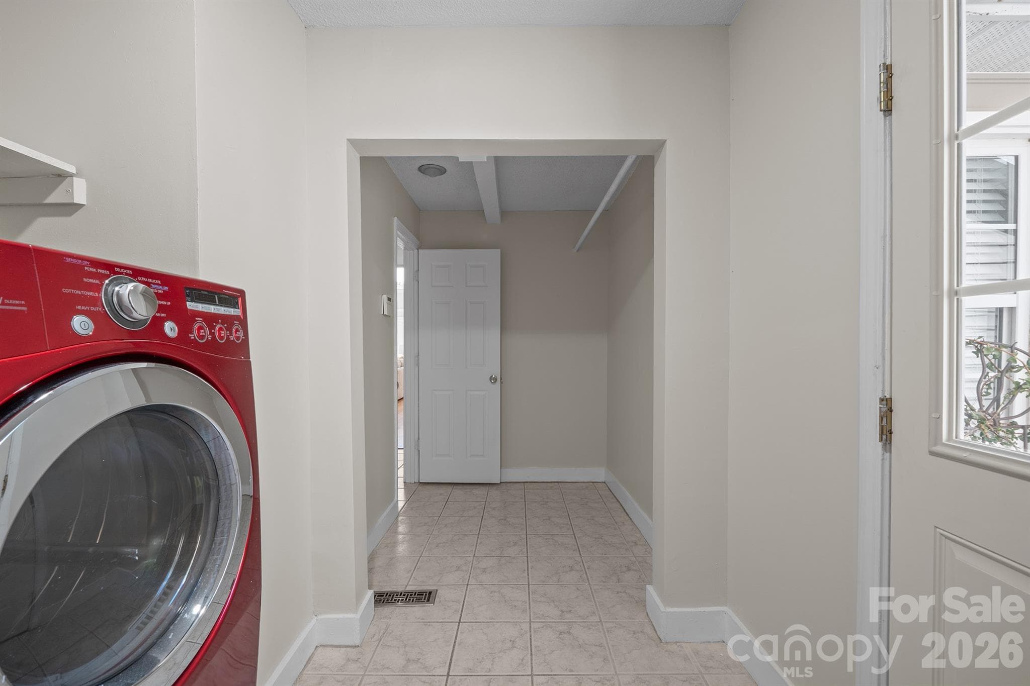 Large laundry is off the garage and the entryway - 20919 Island Forest Drive, Cornelius