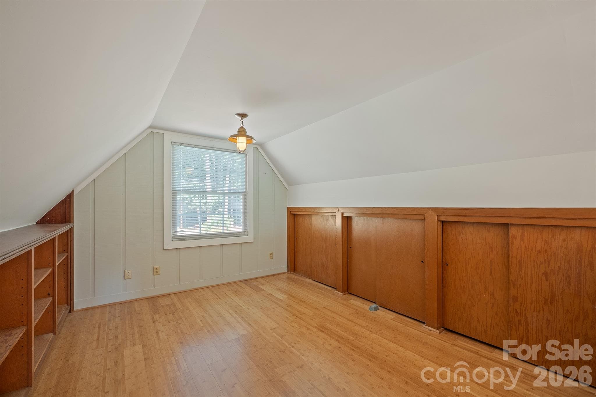 The loft off the Great room offers storage, bookshelves a reading nook, playroom or another home office  or even room for kids to bunk - 20919 Island Forest Drive, Cornelius