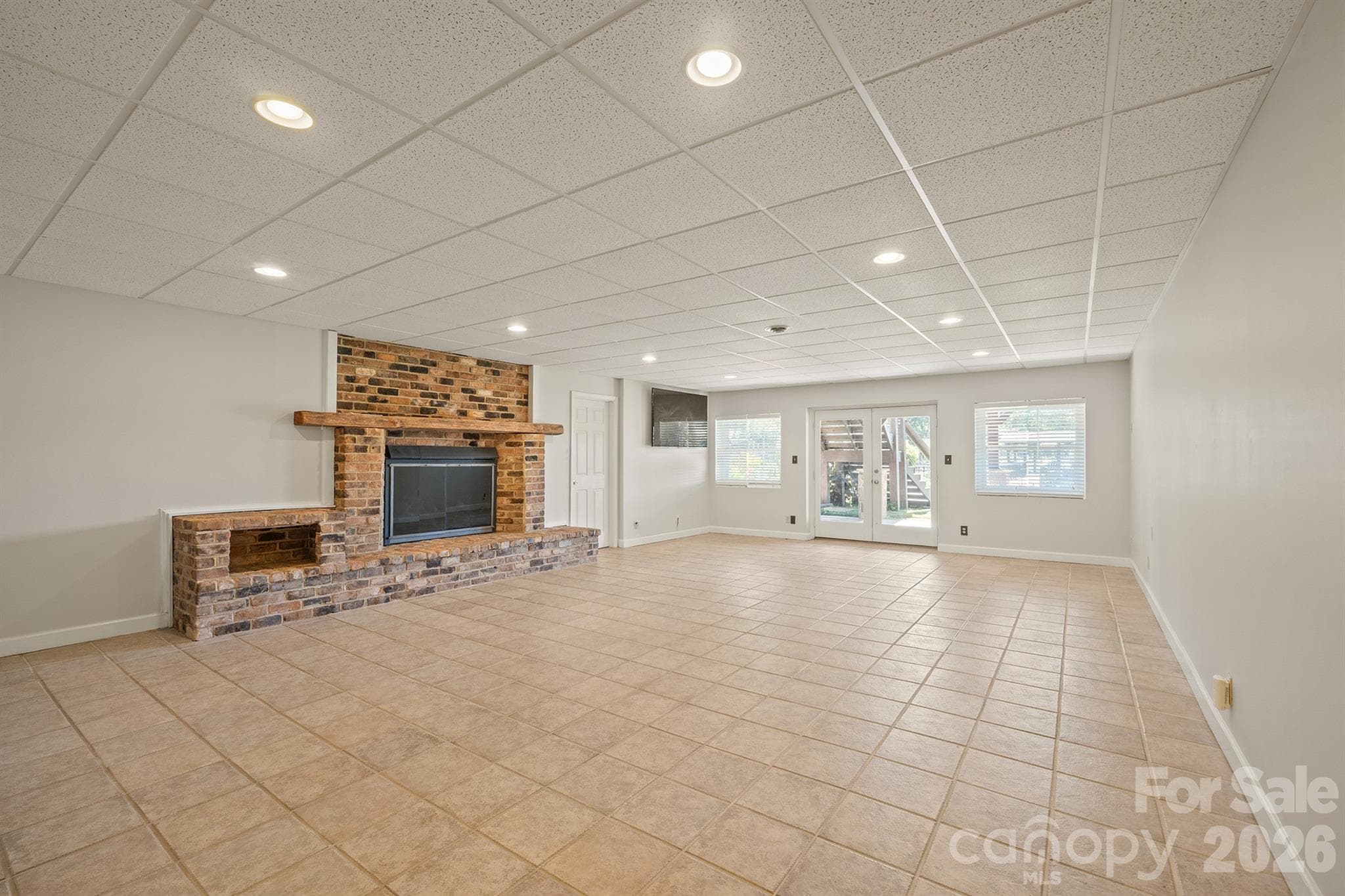 Down to your basement with second Brick fp and gas logs tiled flooring and easy outdoor acess - 20919 Island Forest Drive, Cornelius