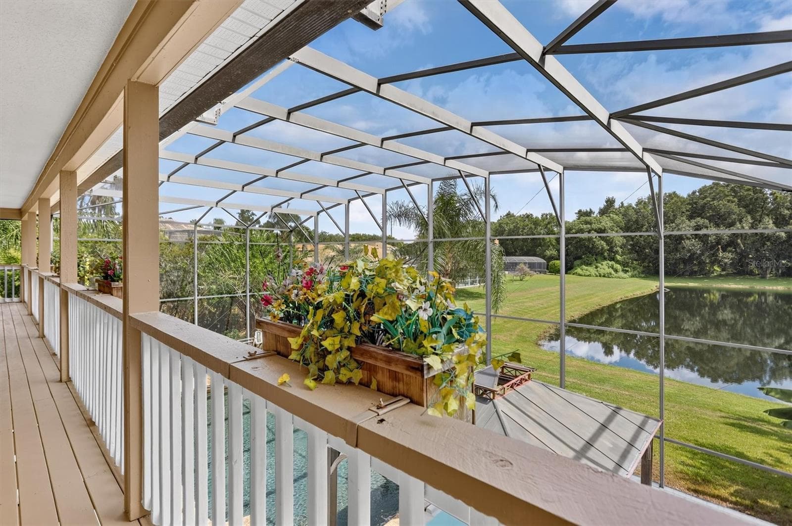 Upper balcony overlooking the screened pool area. - 2109 WEMBLEY PL, OVIEDO