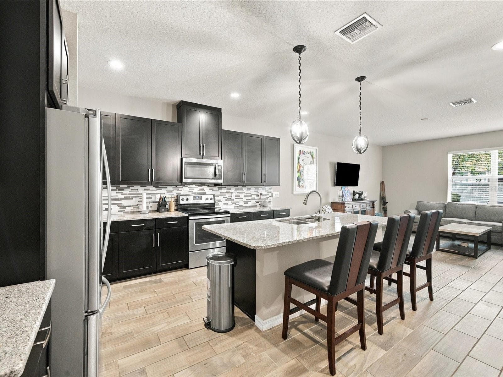 Kitchen overlooking living room. - 18901 CORNUTA ST, LUTZ
