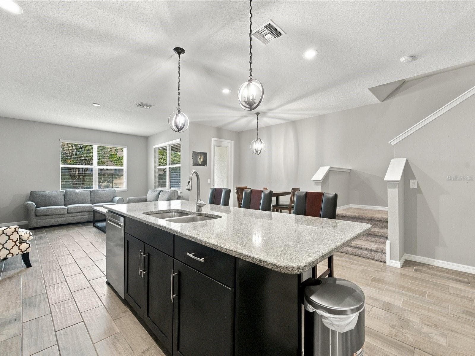 Kitchen overlooking living room. - 18901 CORNUTA ST, LUTZ
