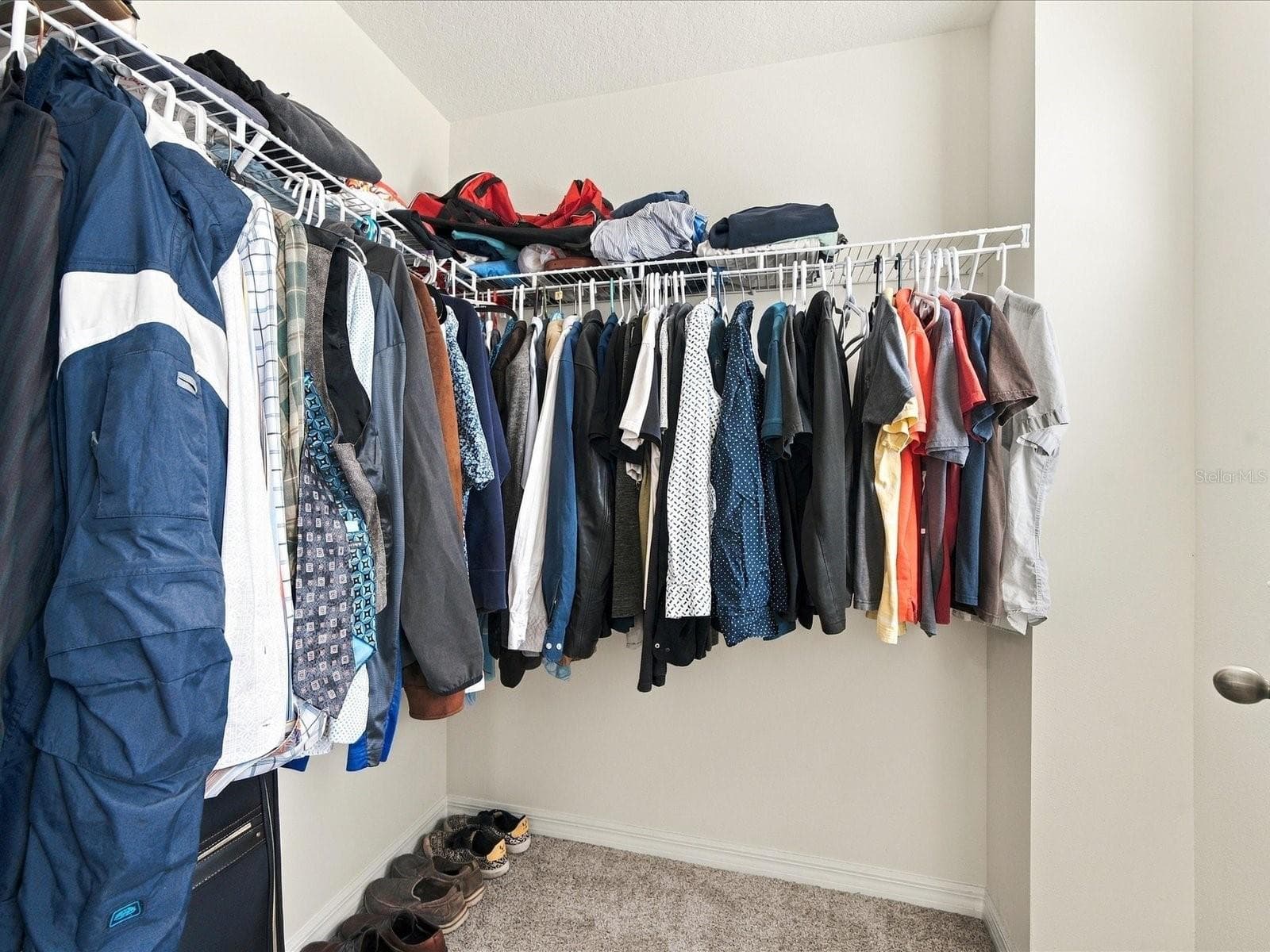 Primary bedroom closet 1. - 18901 CORNUTA ST, LUTZ