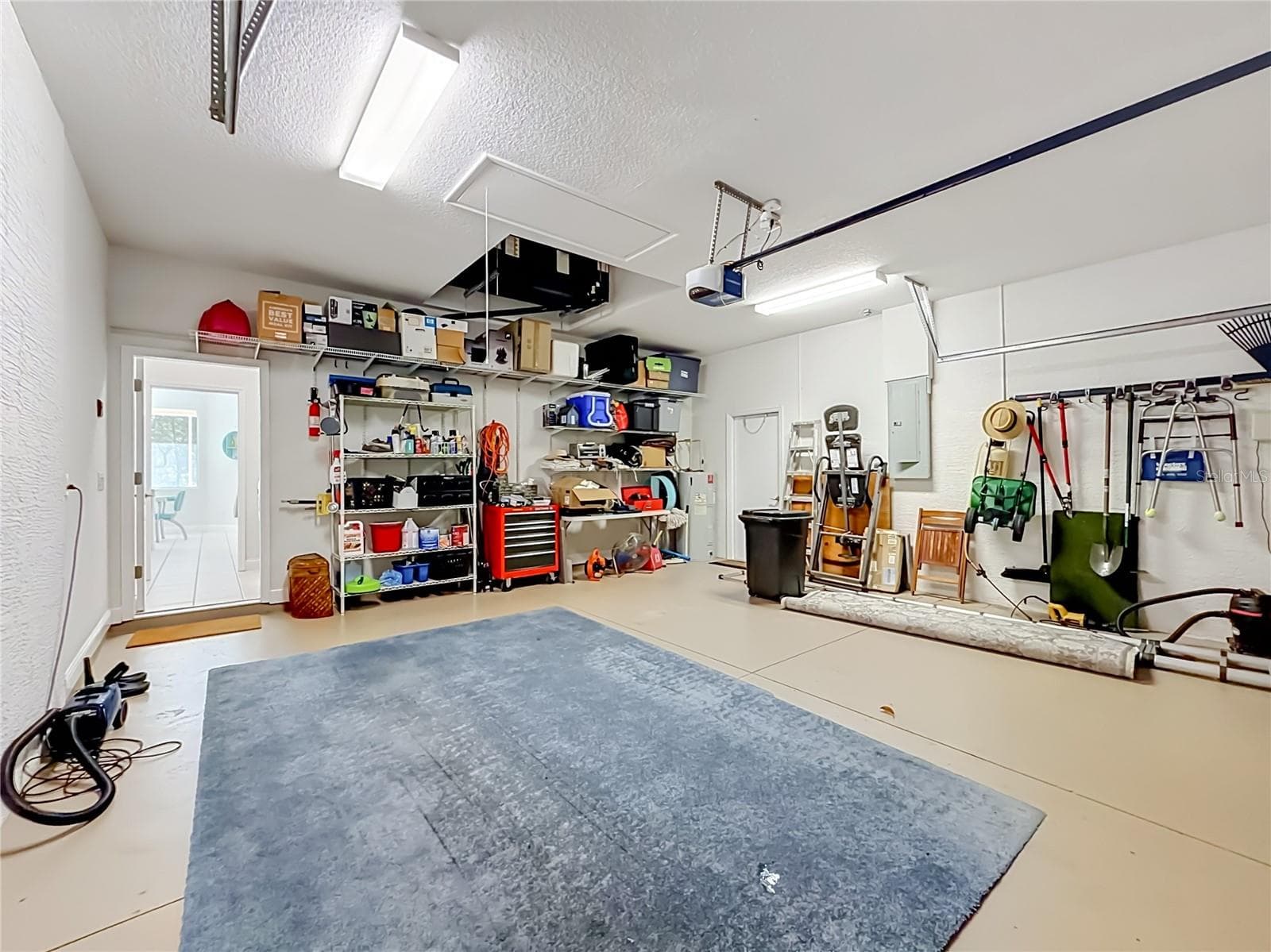 Garage with pull-down ladder attic access and room for a workshop - 2452 W ARBUTUS DR, CITRUS SPRINGS
