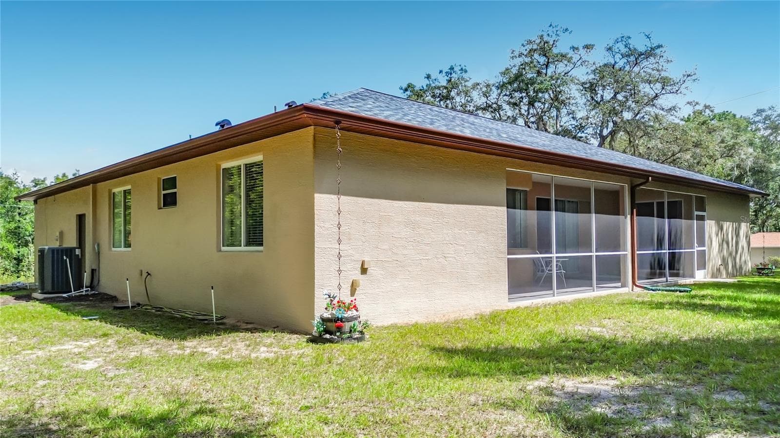 Rear view of the home and spacious yard - 2452 W ARBUTUS DR, CITRUS SPRINGS