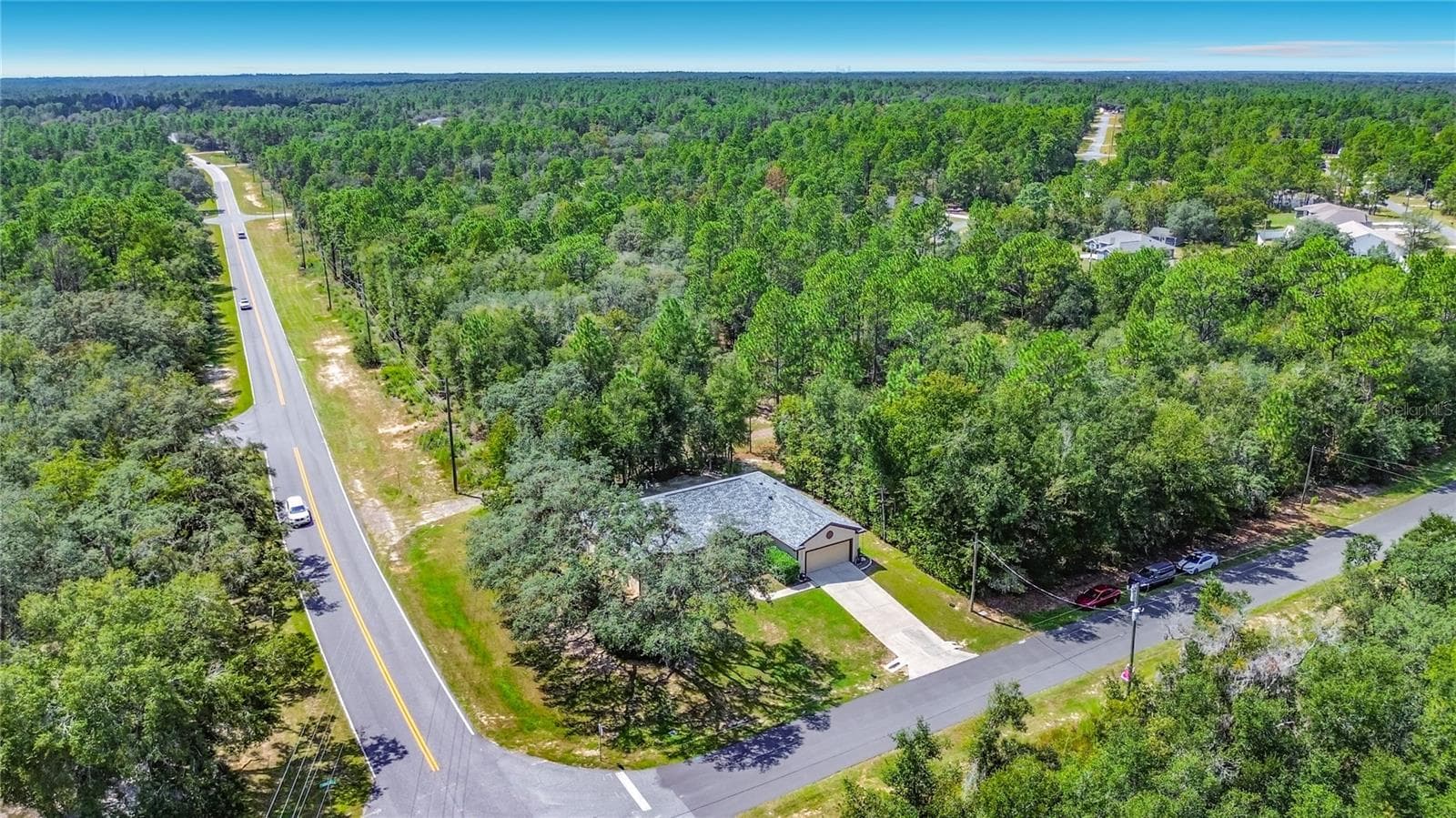 Aerial view of the home on its wooded Citrus Springs lot - 2452 W ARBUTUS DR, CITRUS SPRINGS