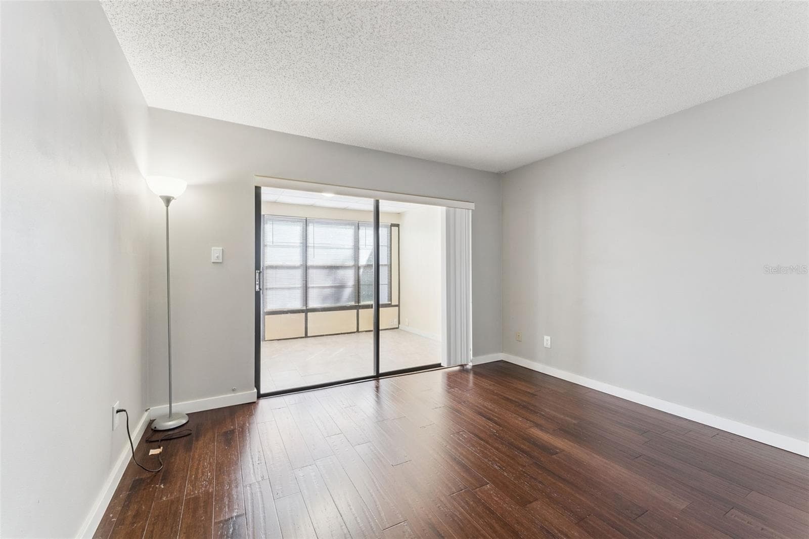 Downstairs bedroom with access to enclosed patio/flex space - great for an office! - 629 WOODRIDGE DR, FERN PARK