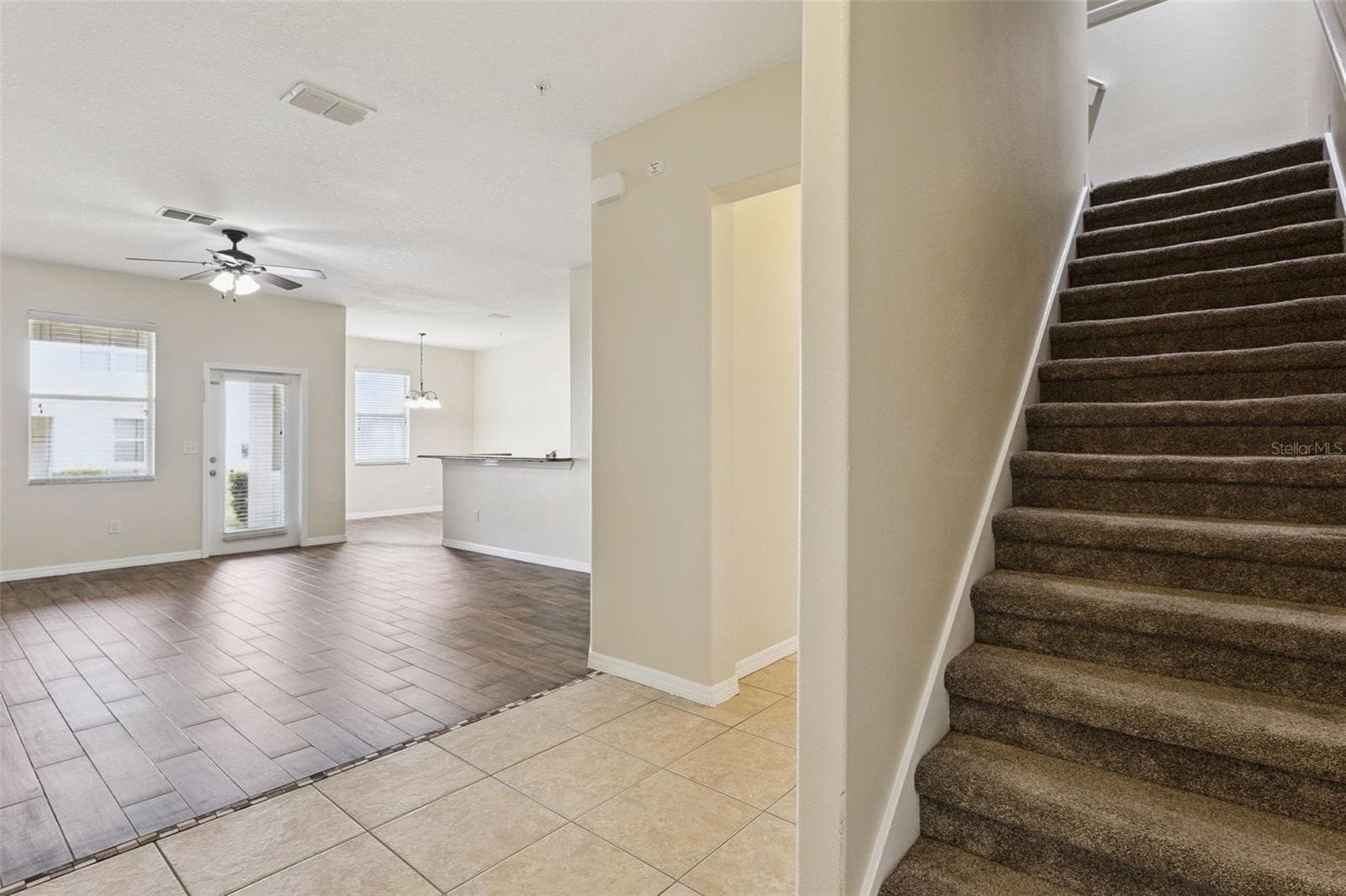 stairway going up, looking towards living room and kitchen - 15515 CAMPDEN ST, WINTER GARDEN