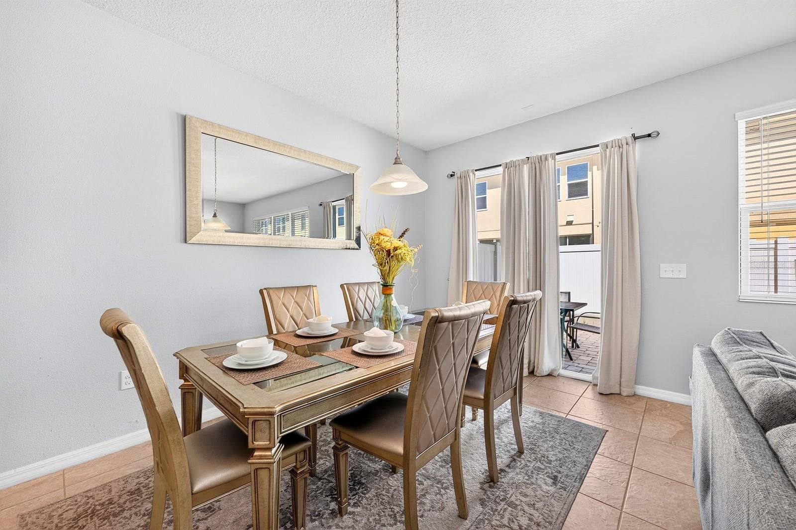 Dining area has sliding glass doors that open to the paver patio. - 5109 KILLARNEY WAY, KISSIMMEE