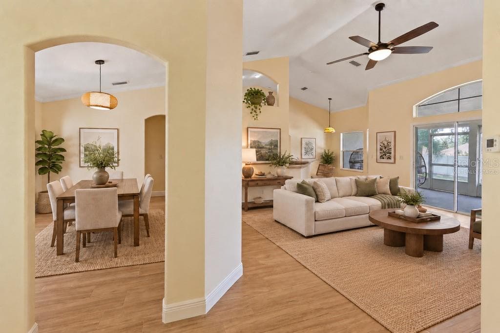 Virtually Staged - View of dining and living from front door - 10814 VINEYARD CT, CLERMONT