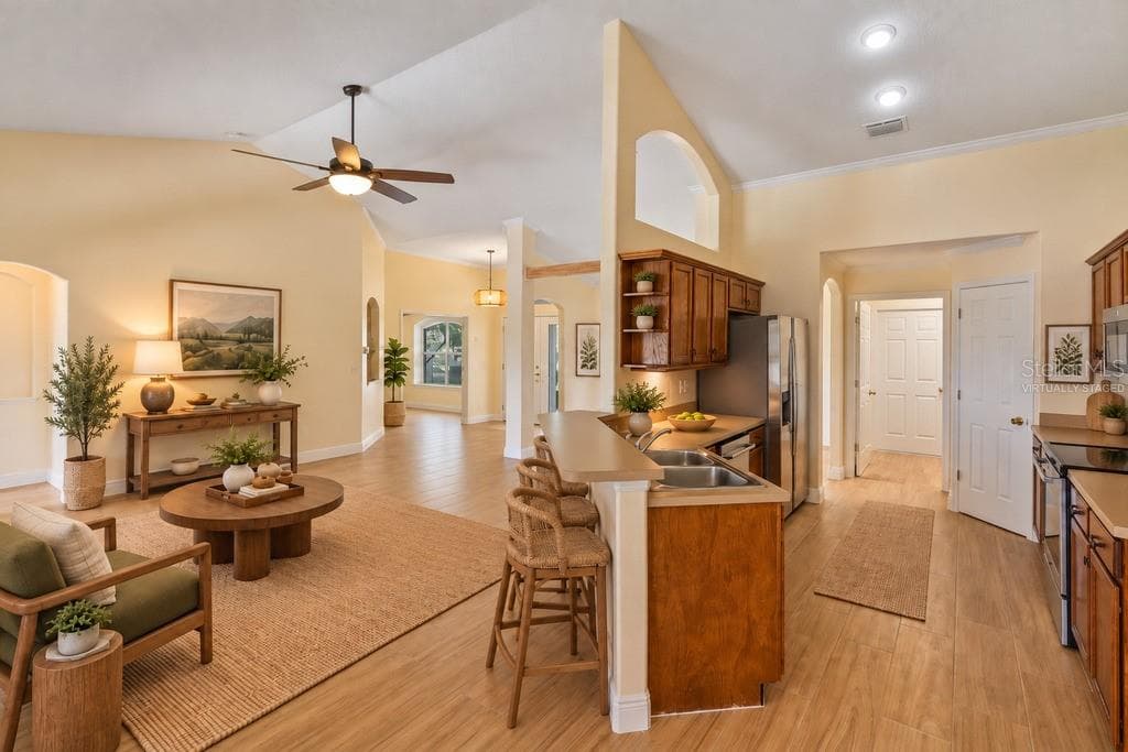 Virtually Staged - Kitchen and living room - 10814 VINEYARD CT, CLERMONT