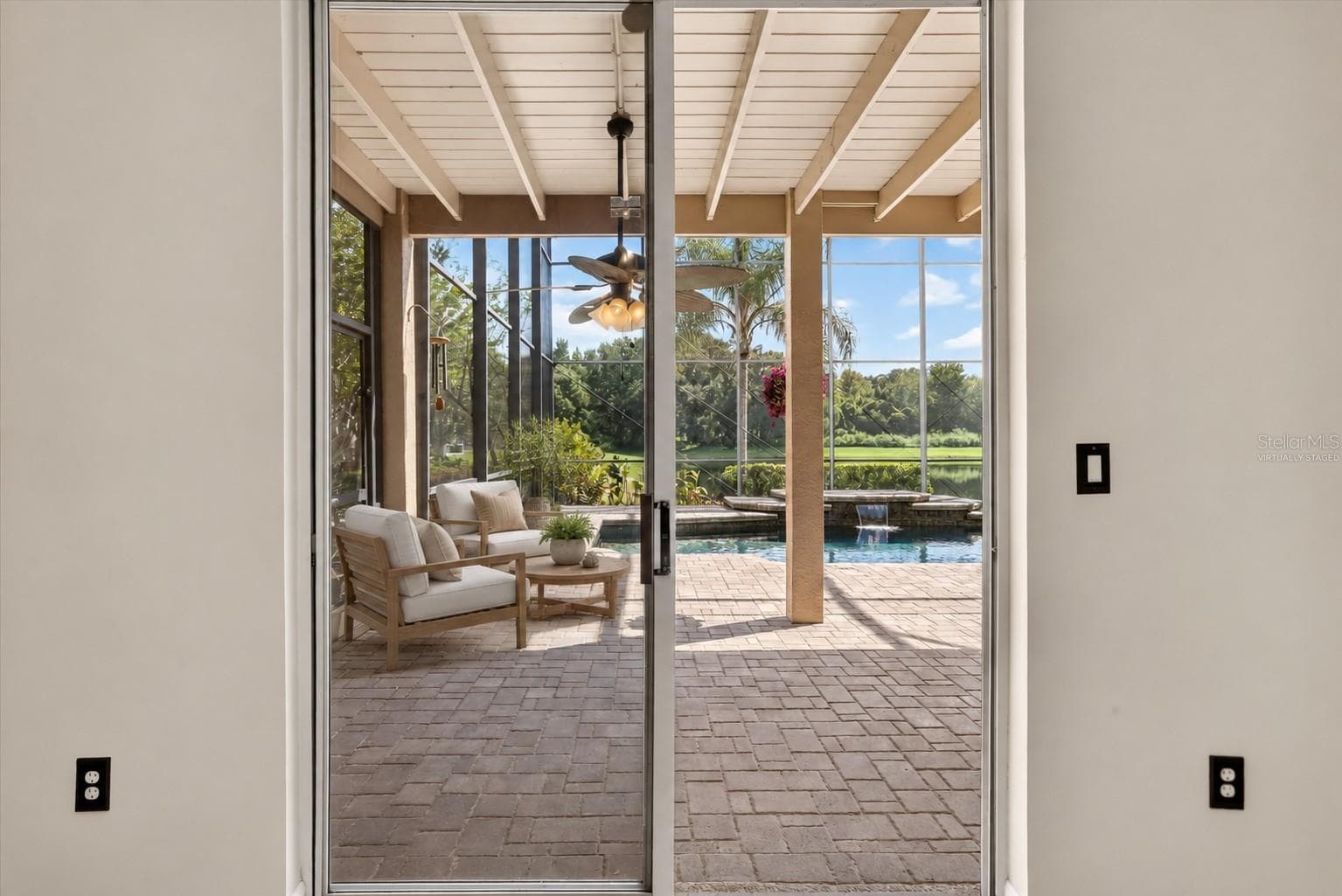 Virtually staged: View to the pool and pond from kitchen - 2109 WEMBLEY PL, OVIEDO