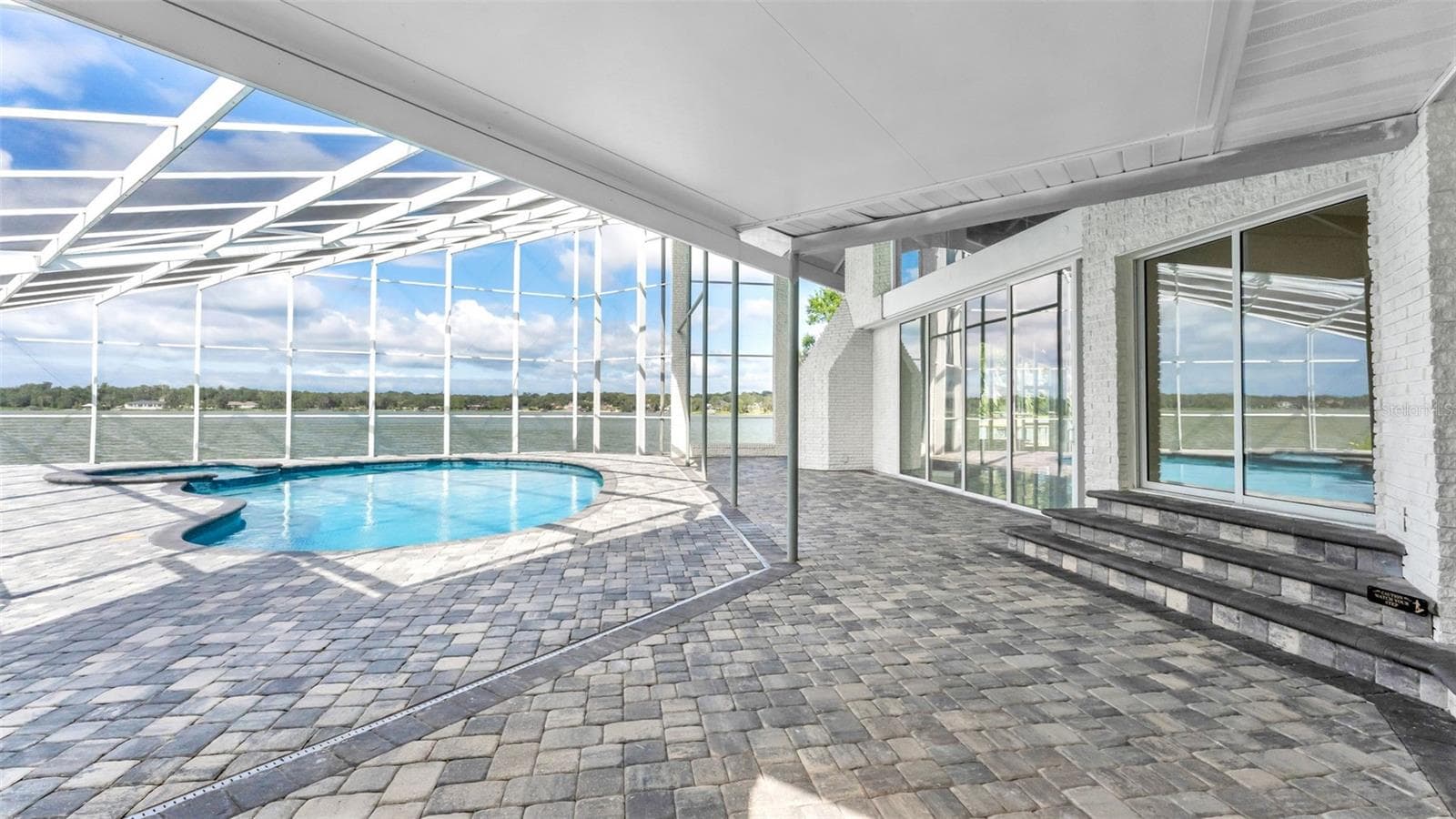 Covered poolside patio - 5934 PIER PLACE DR, LAKELAND