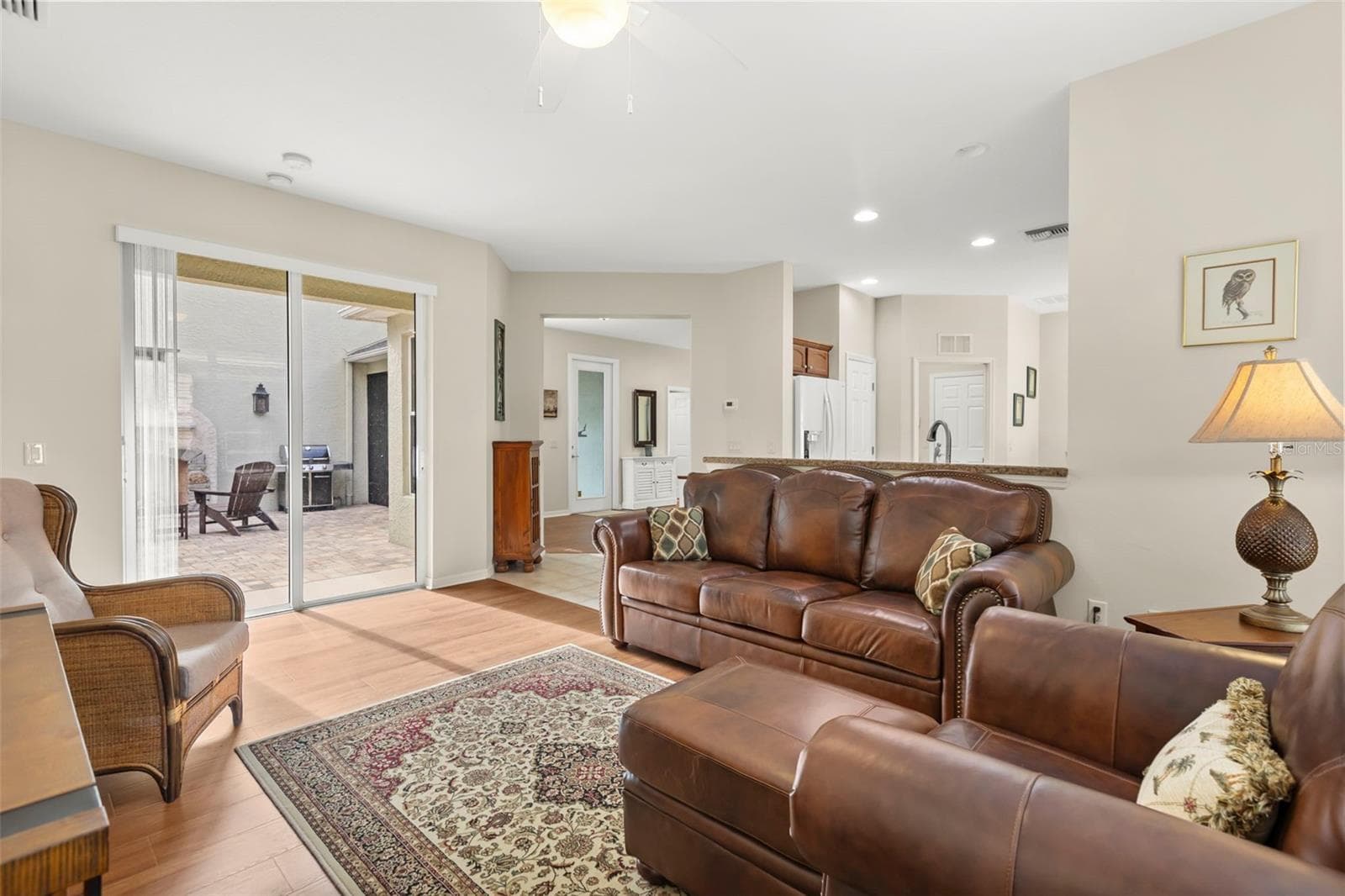 Living Room with Open Flow to Kitchen and Bonus Room - 4711 HERITAGE TRL, LEESBURG