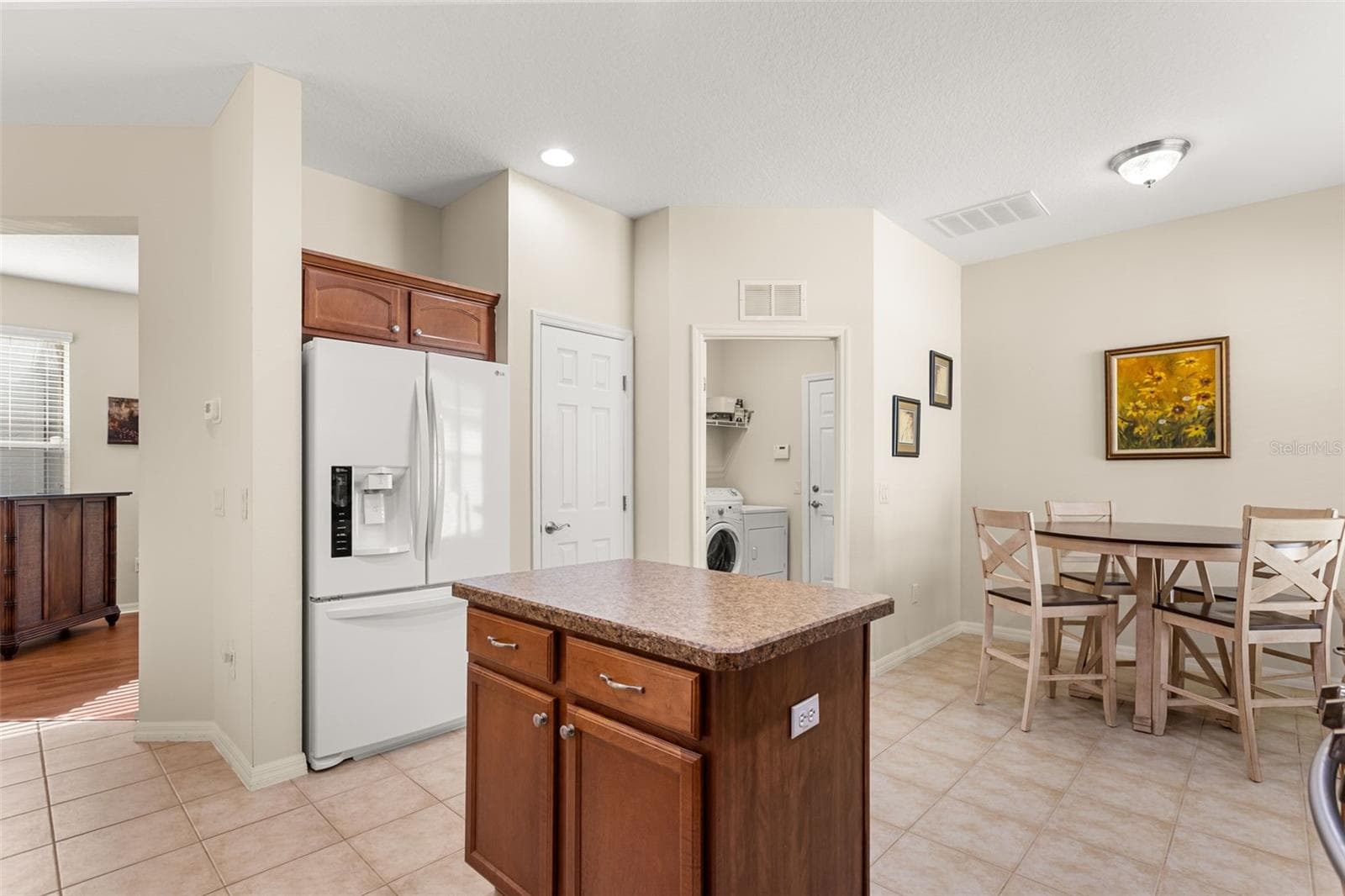 Kitchen with Center Island and Adjacent Dining Area - 4711 HERITAGE TRL, LEESBURG