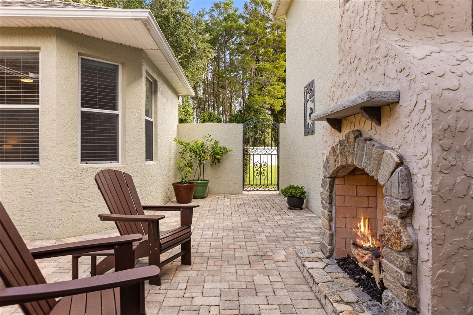 Private Courtyard with Stone Gas Fireplace, Paver Patio & 2 Handmade Copper Gas Lanterns - 4711 HERITAGE TRL, LEESBURG