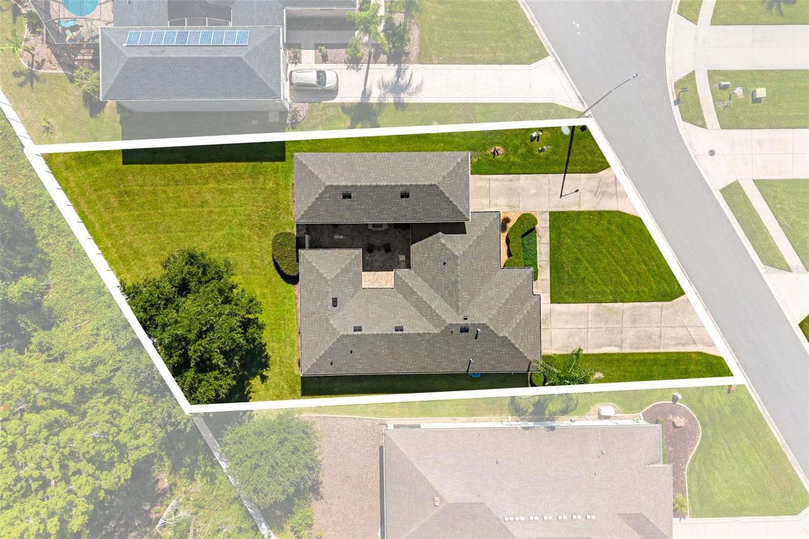 Aerial View Highlighting Spacious homesite and RV Garage - 4711 HERITAGE TRL, LEESBURG