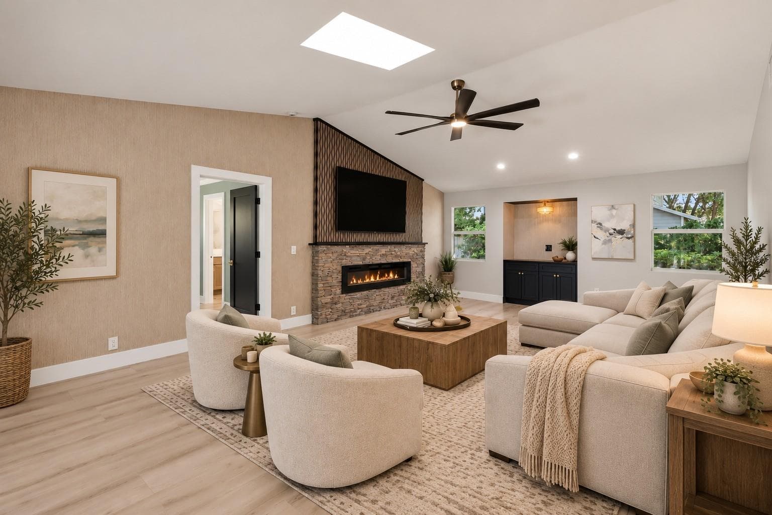 Family room featuring stunning accent wall and fireplace - 1411 70TH ST NW, BRADENTON