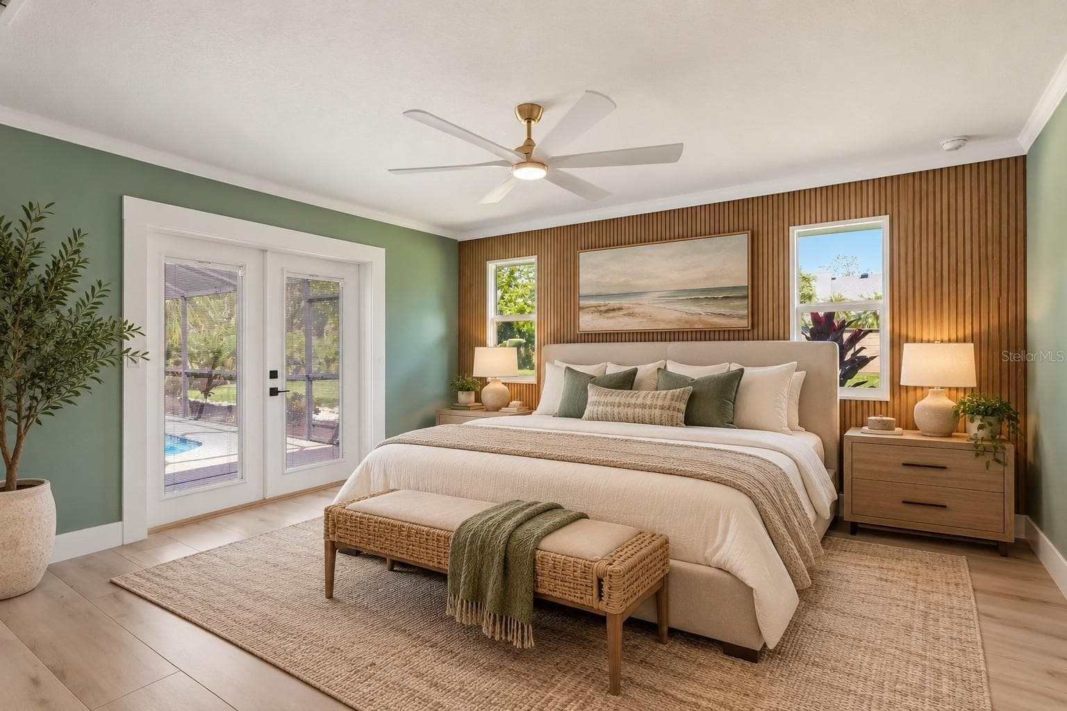Primary Bedroom featuring beautiful wood accent wall - 1411 70TH ST NW, BRADENTON