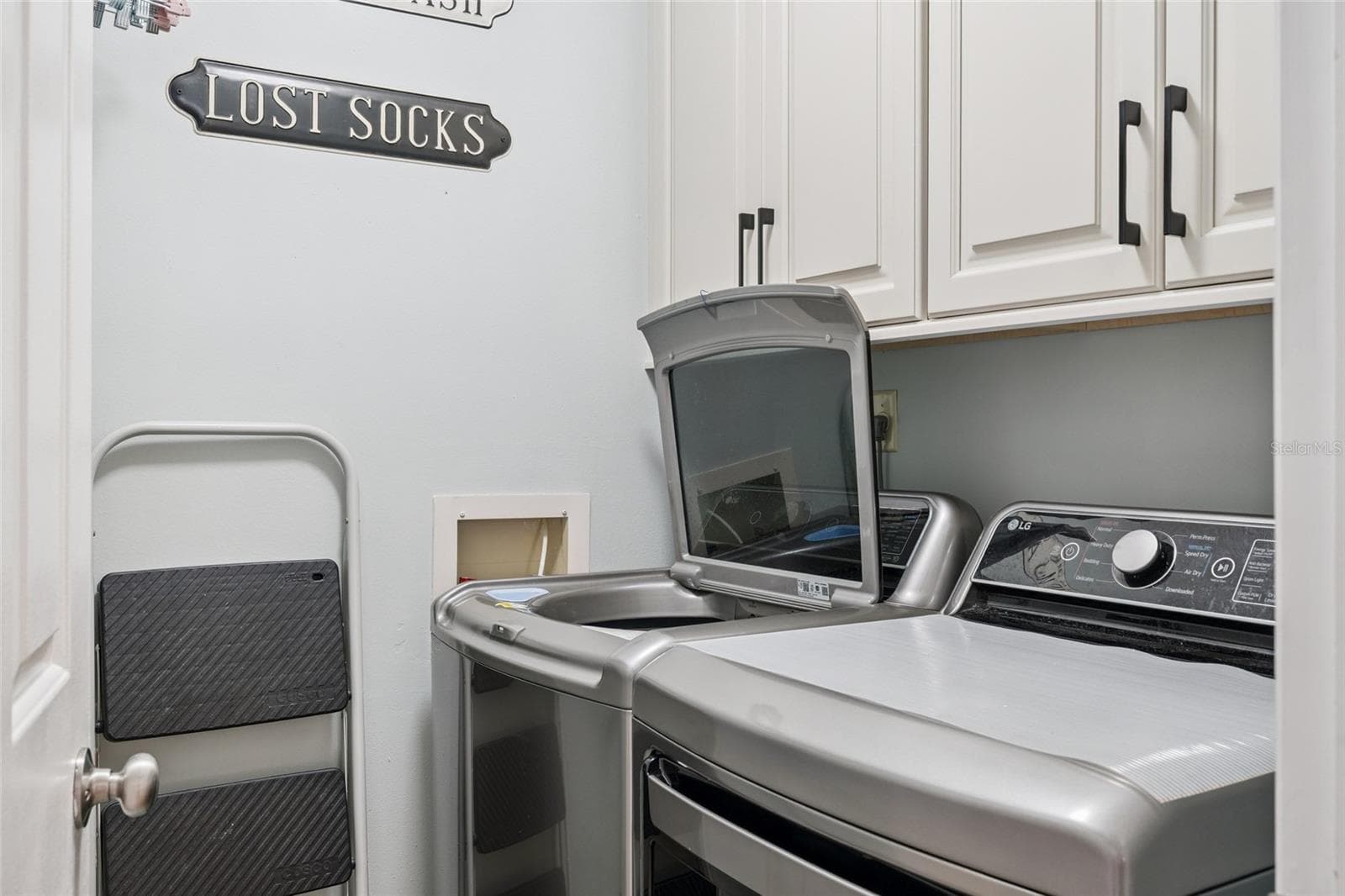 Washer and dryer at end of hallway - 1266 SAINT TROPEZ CIR #1266, ORLANDO