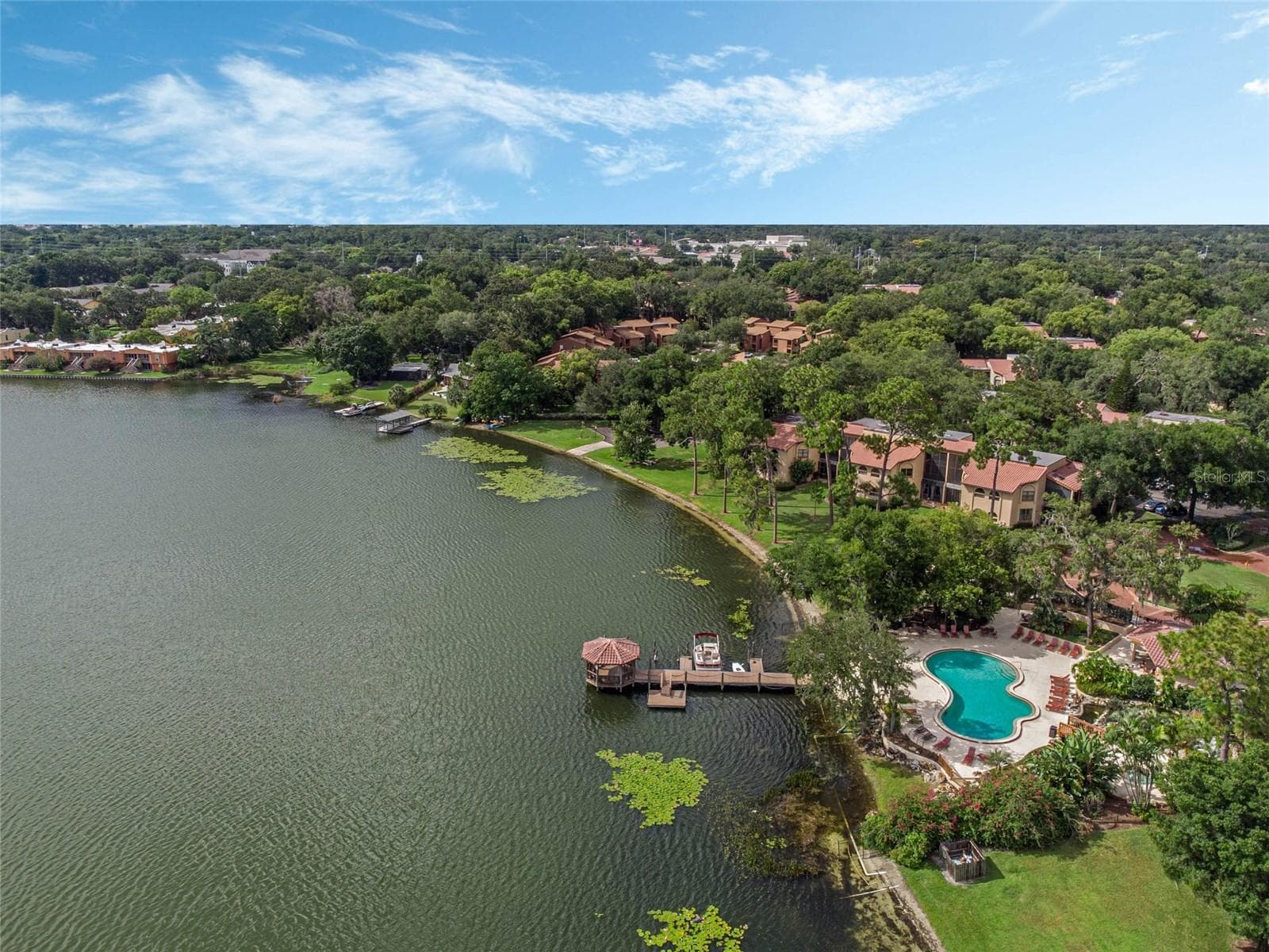 Clubhouse and pool overlooking Lake Pinelock - 1266 SAINT TROPEZ CIR #1266, ORLANDO