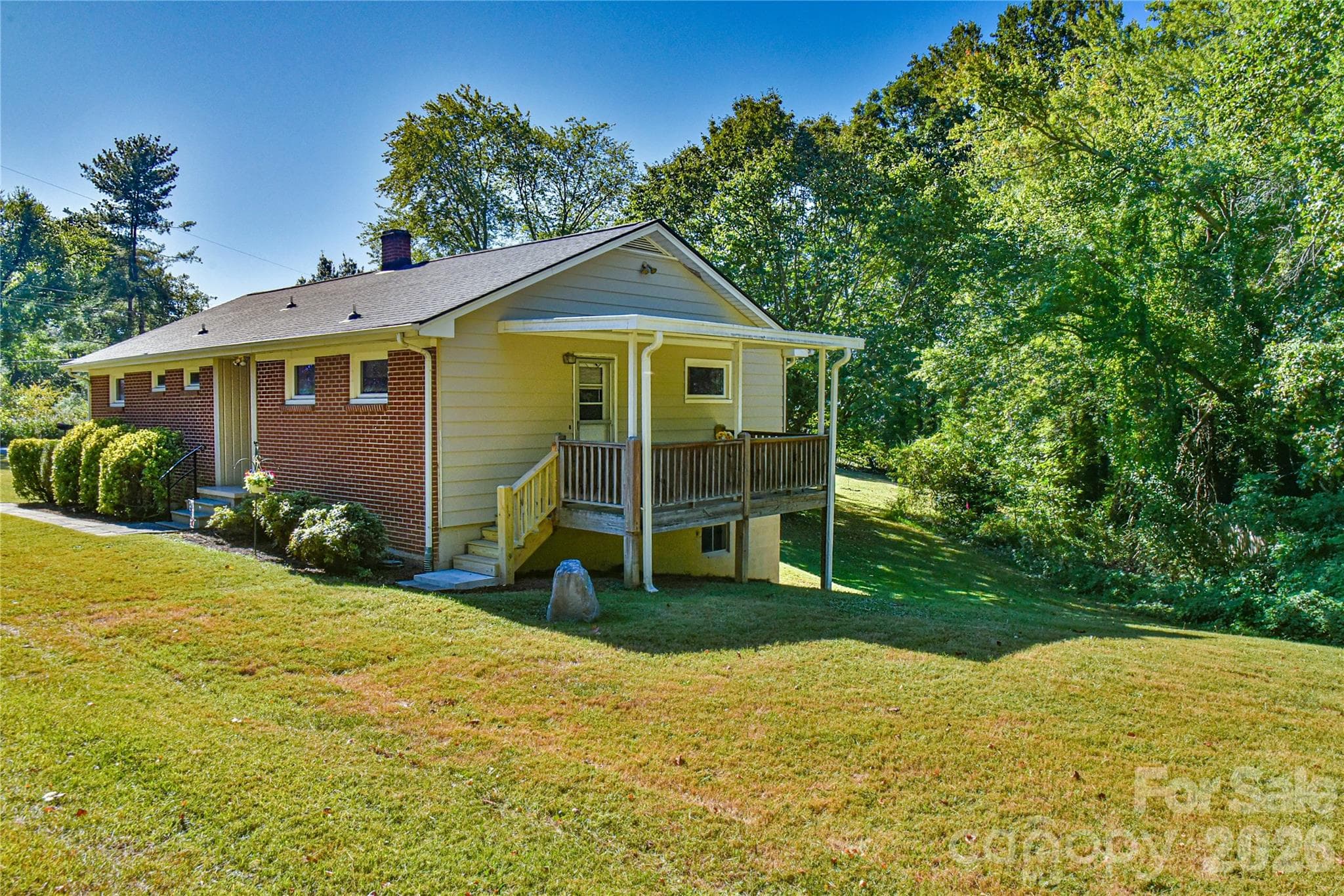 Nice covered porch right off the kitchen. A great place to enjoy your morning coffee. - 505 Monte Vista Road, Candler