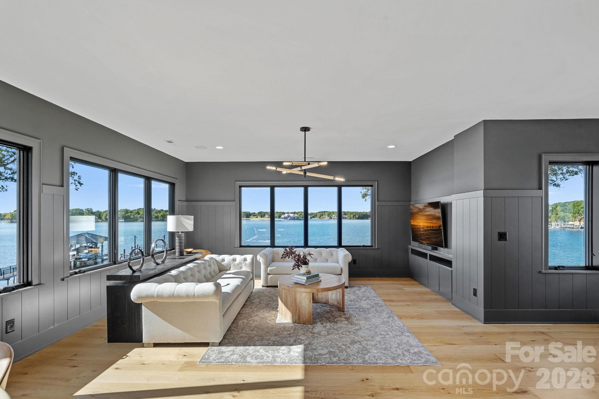Expansive upper-level bonus room wrapped in panoramic lake views, offering generous space for lounging, games and entertaining. - 17811 Largo Place, Cornelius