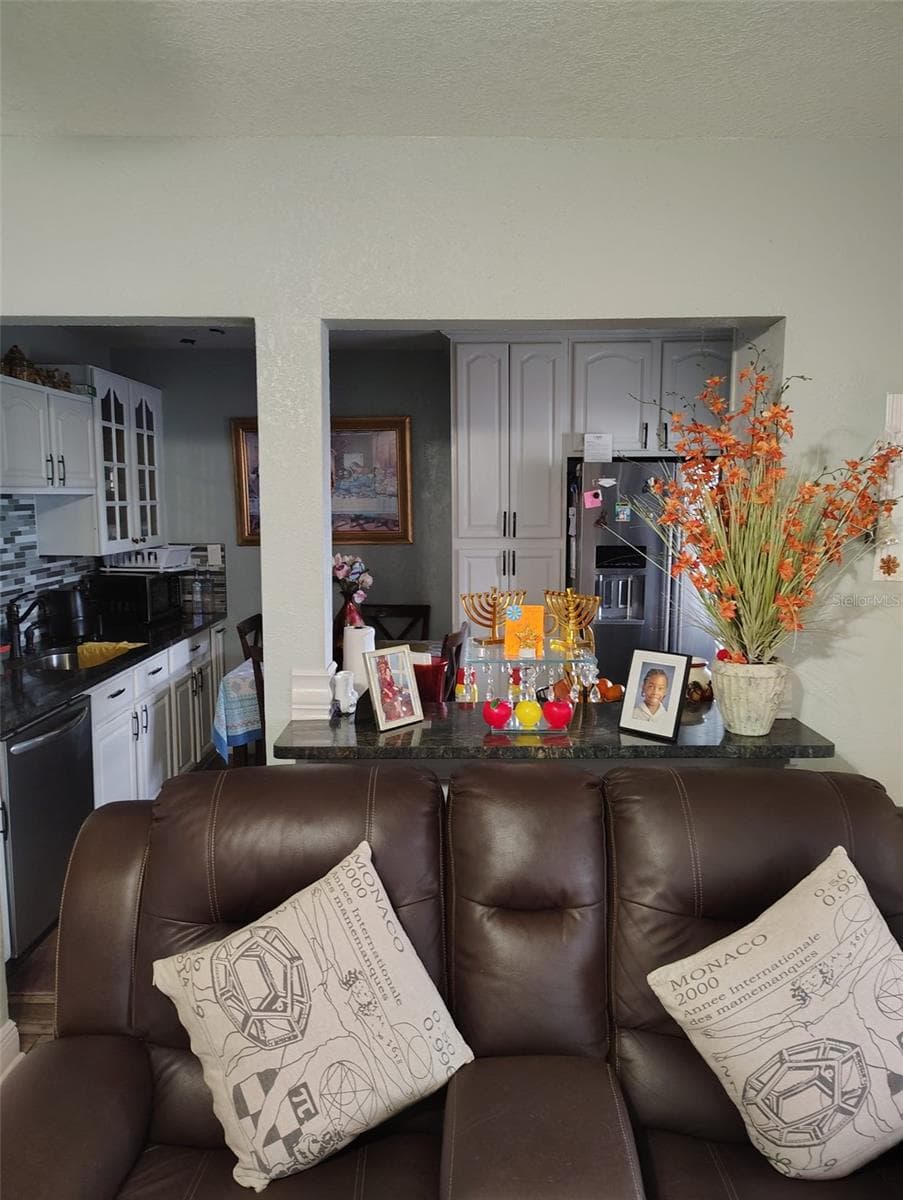 KITCHEN VIEW FROM THE LIVING ROOM - 6913 BLOSSOM AVE, TAMPA