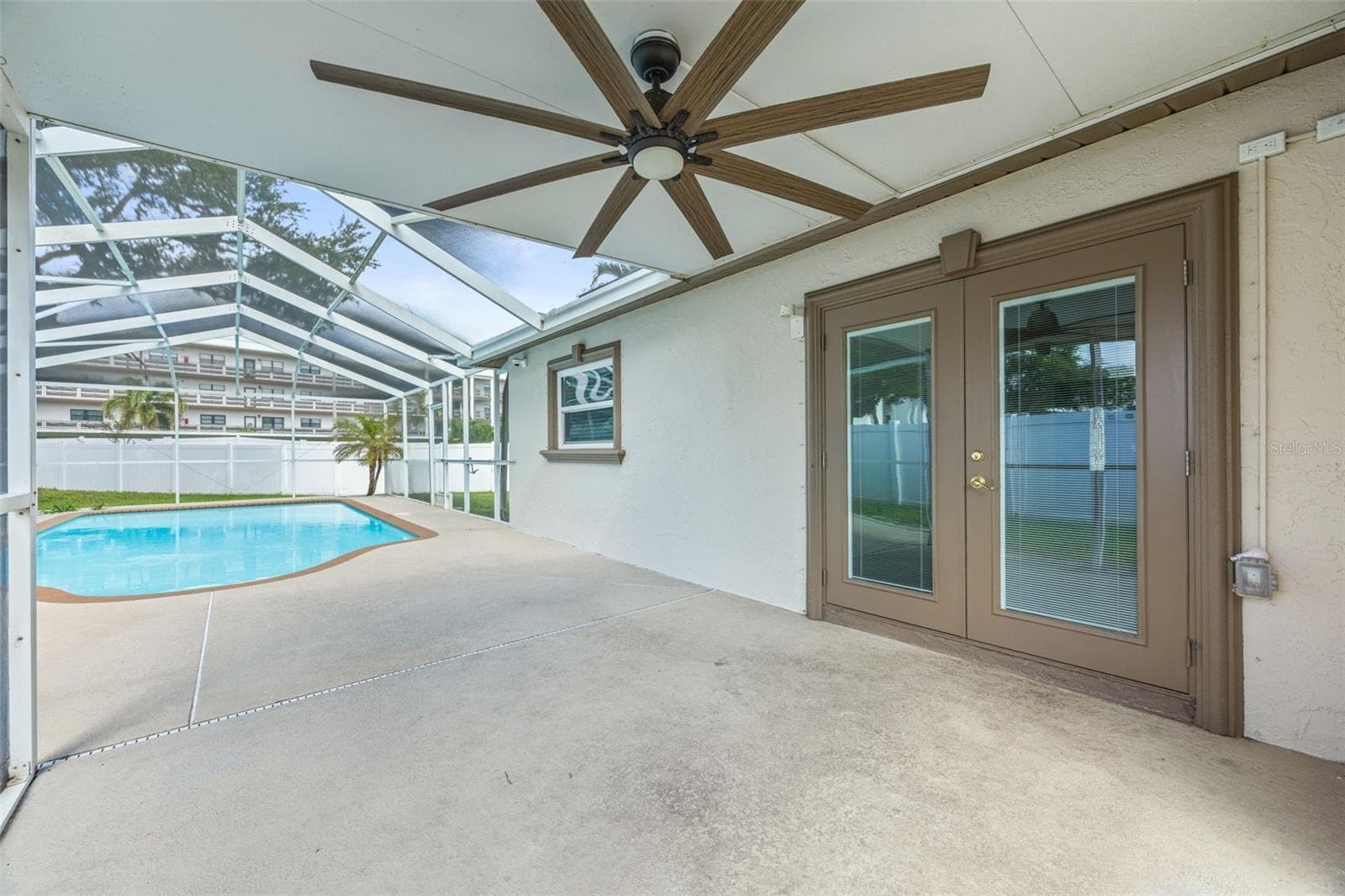 Covered Patio with ceiling fan - 7892 SUNDOWN DR N, ST PETERSBURG