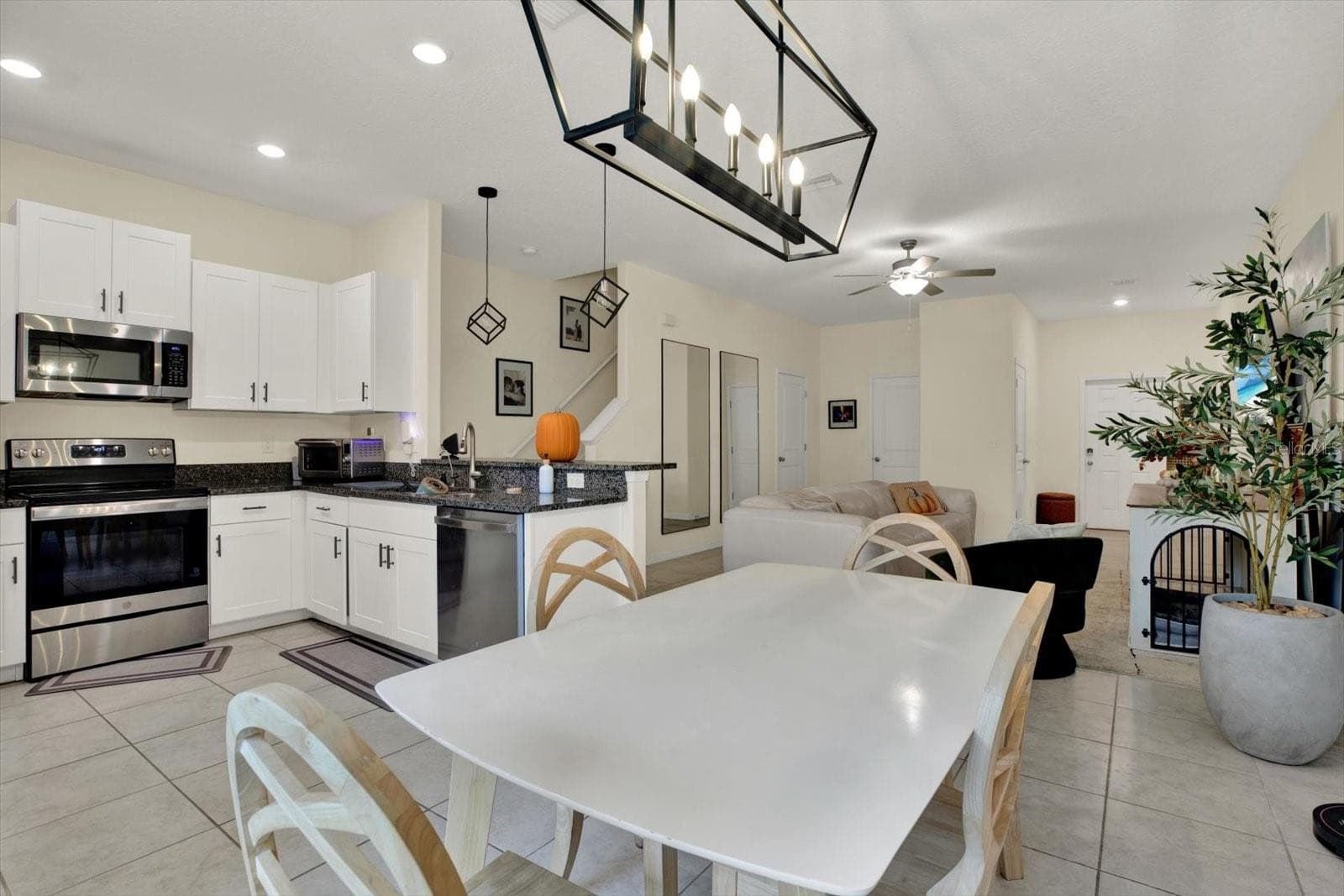 Kitchen, dining, and living areas in one open layout - 8538 REEDVILLE ST, NEW PORT RICHEY