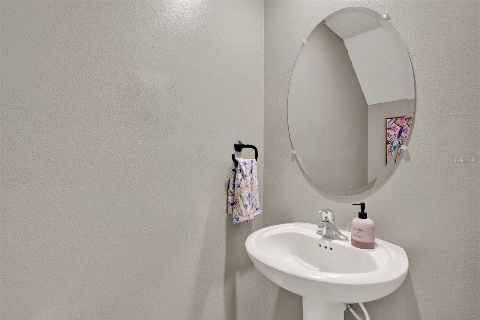 First floor Half bath with pedestal sink - 8538 REEDVILLE ST, NEW PORT RICHEY