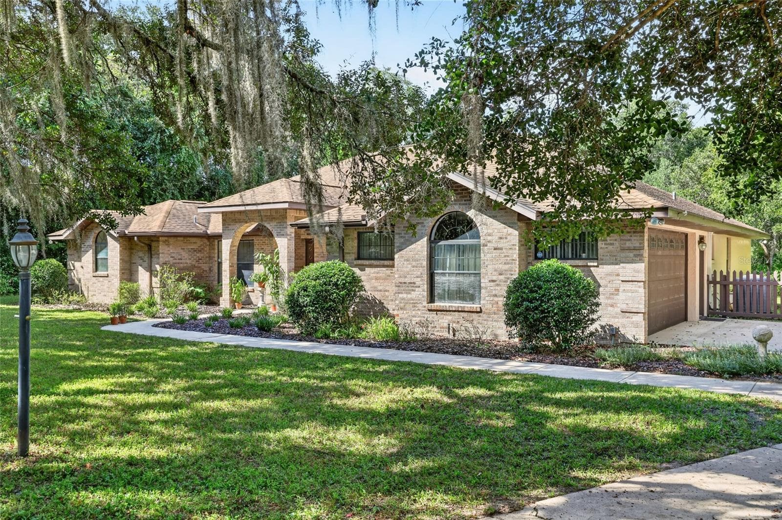 On a one acre parcel with mature trees. - 3450 SW 52ND TER, OCALA