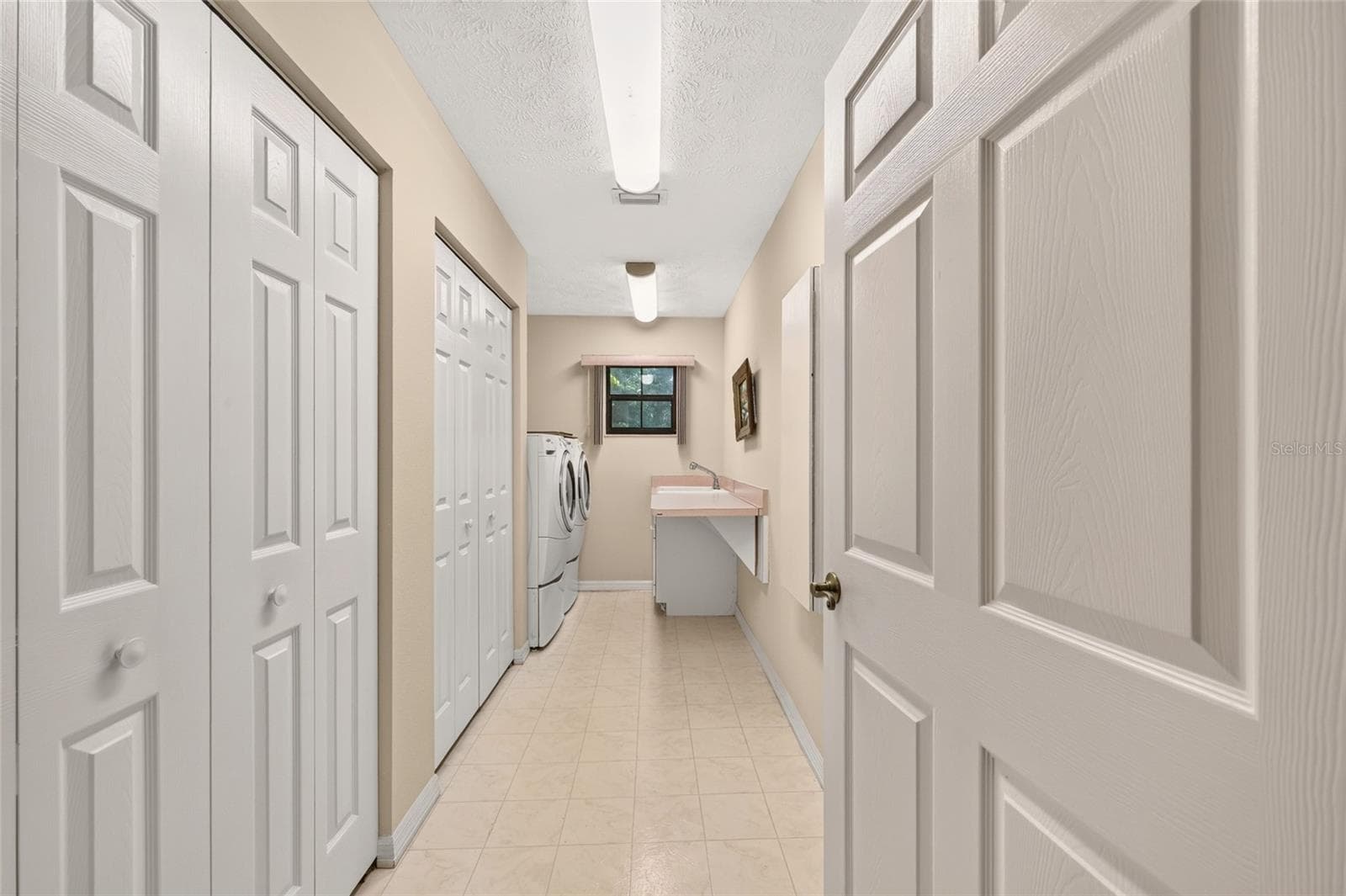 Inside laundry room with ample storage. - 3450 SW 52ND TER, OCALA