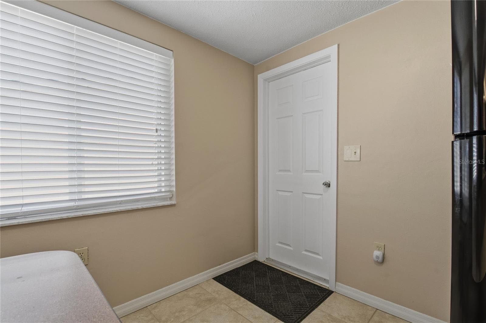 Door going to the garage - 7420 SANDALWOOD DR, PORT RICHEY