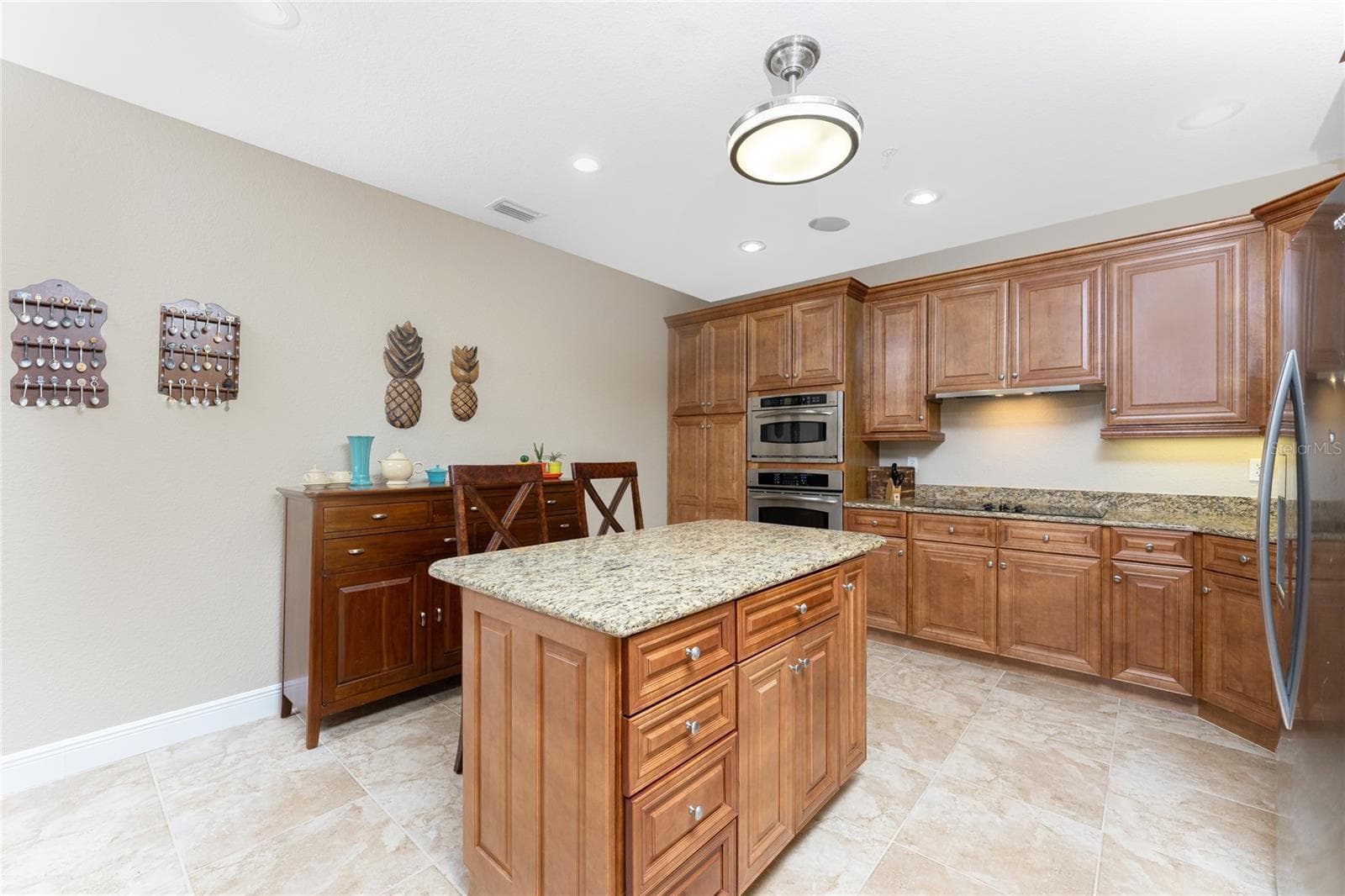 The celing light is a beautiful fandlier that open to a fan - 95 N MARION CT #226, PUNTA GORDA