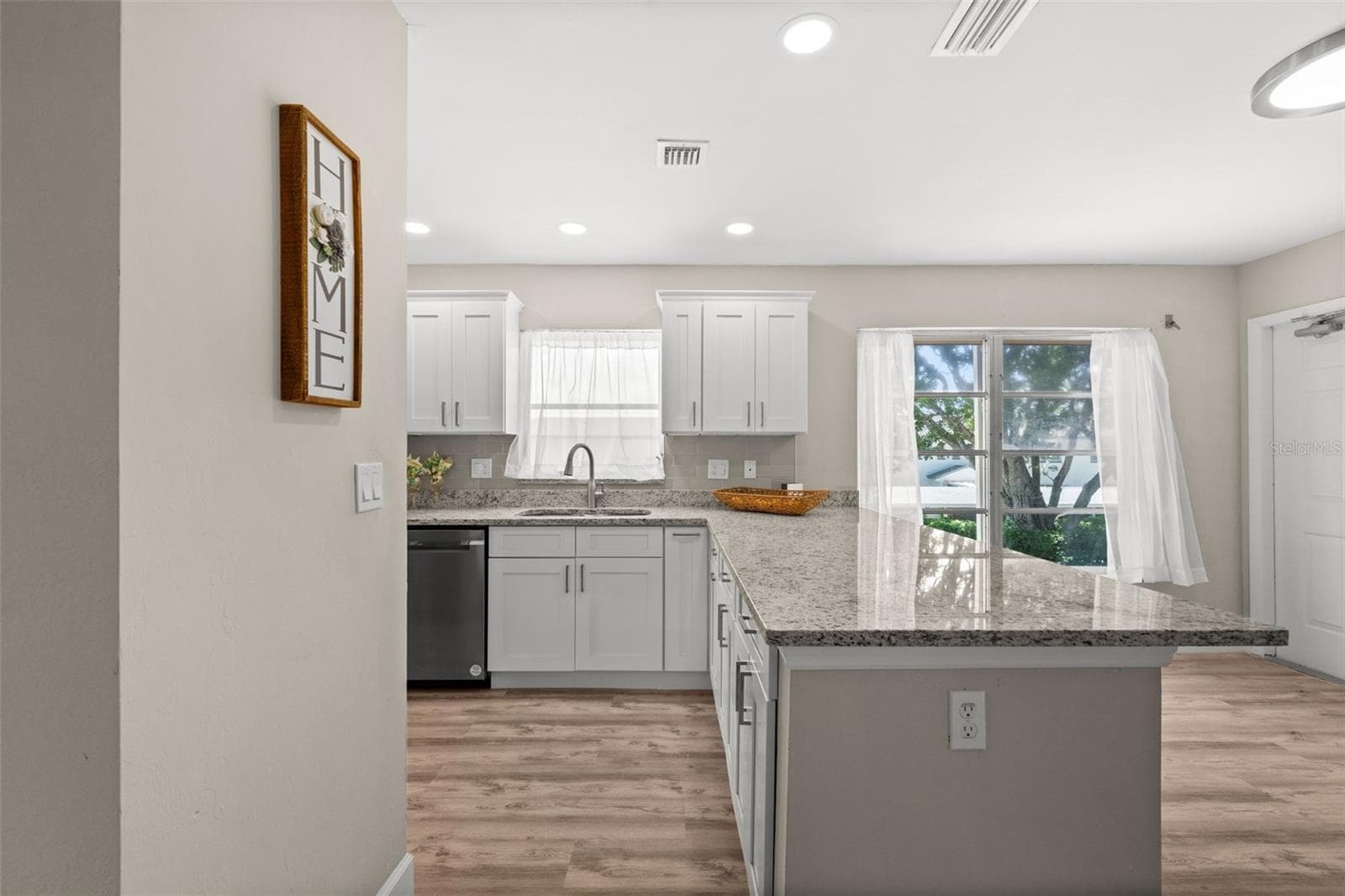 Looking from the kitchen to the front entry - 1345 SE 40TH TER #2E, CAPE CORAL