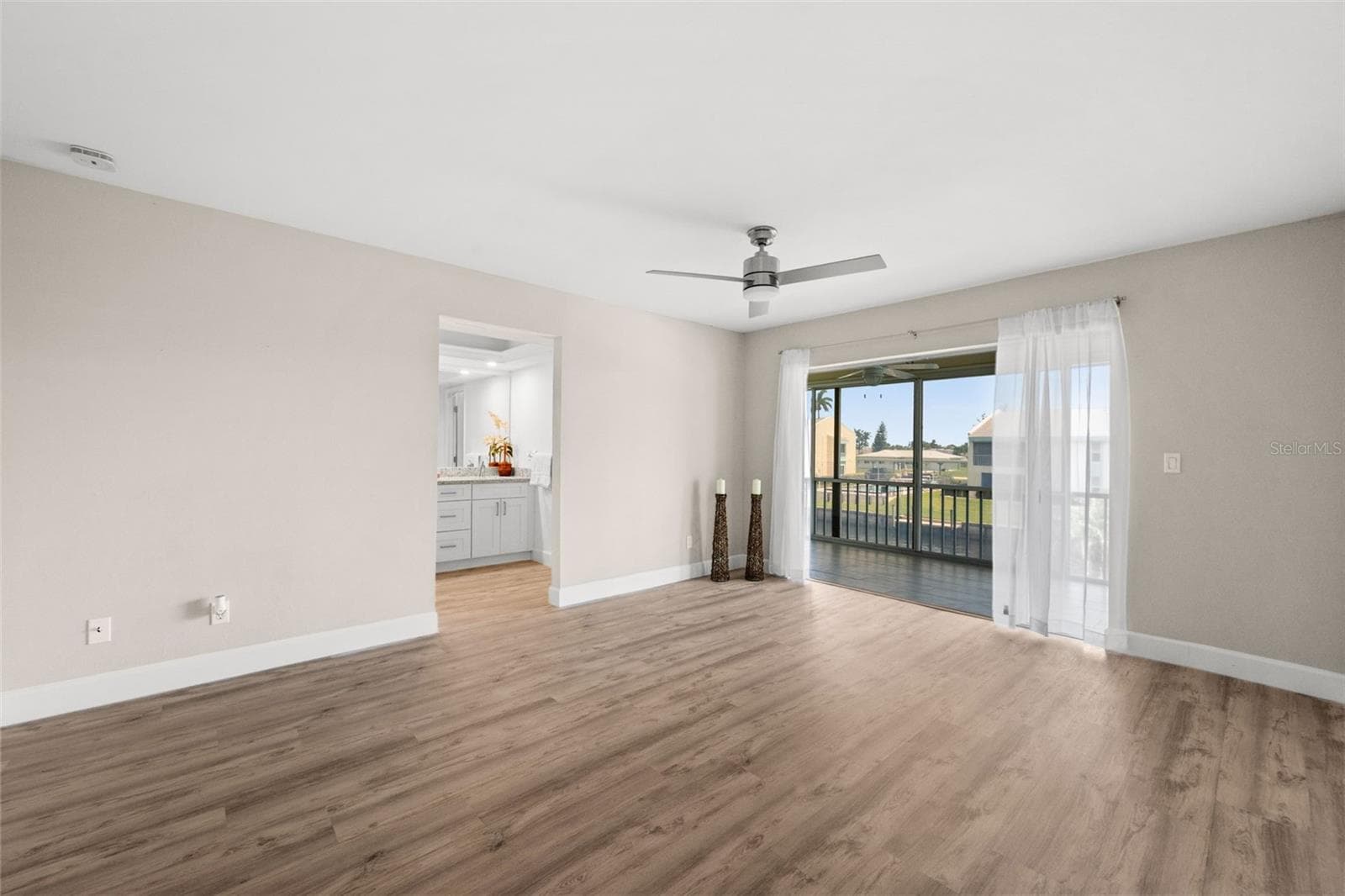 Primary bedroom with direct access to the lanai - 1345 SE 40TH TER #2E, CAPE CORAL