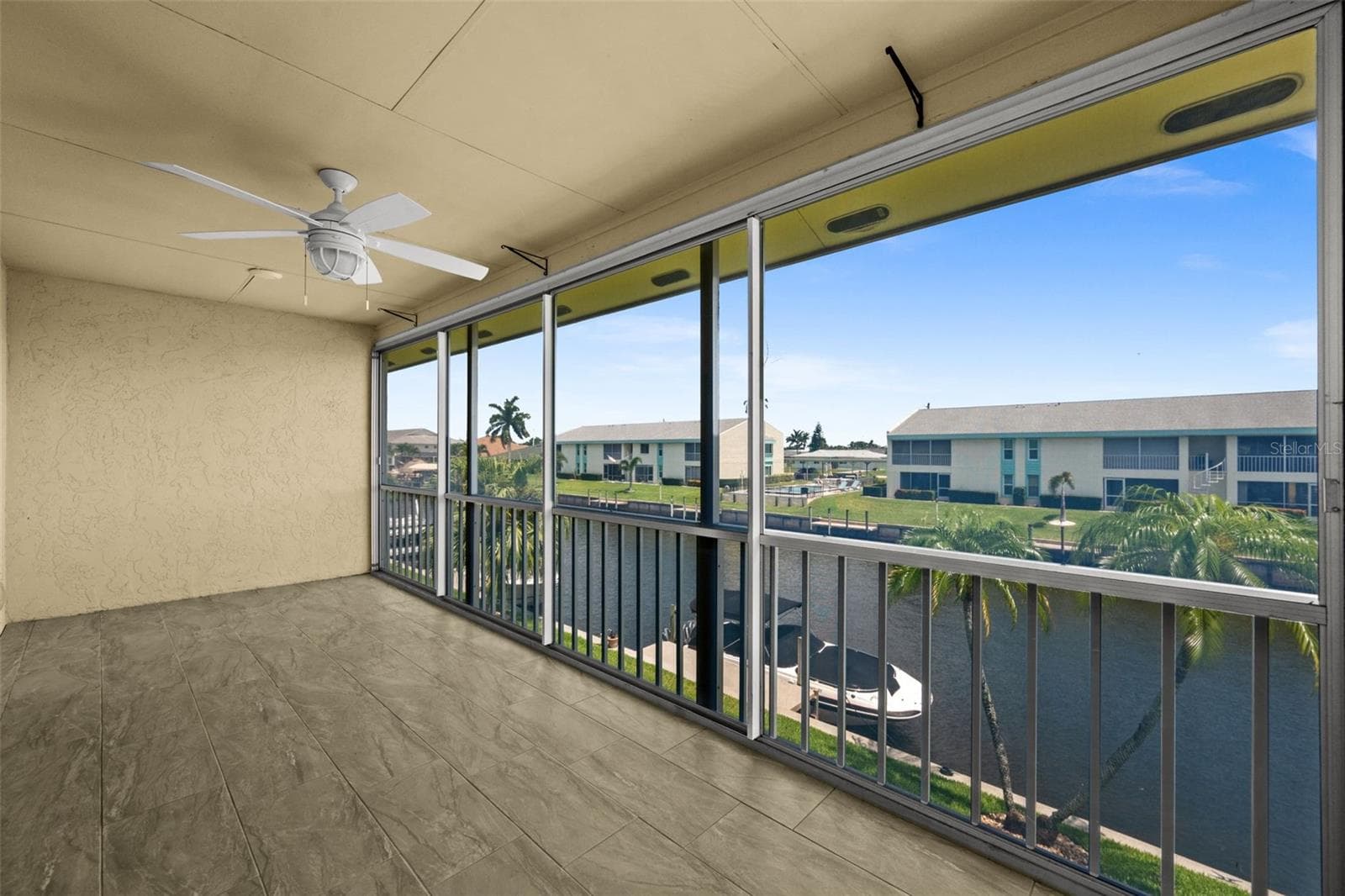 Lanai overlooking the gulf access canal - 1345 SE 40TH TER #2E, CAPE CORAL