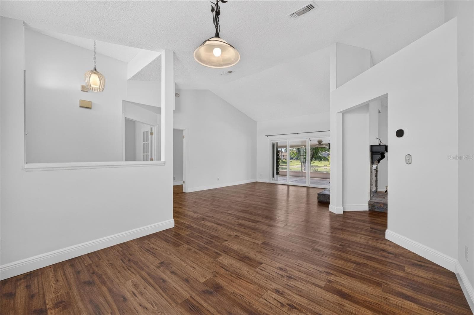 The formal dining room that opens to the formal living room. - 2925 EAGLE LAKE DR, ORLANDO