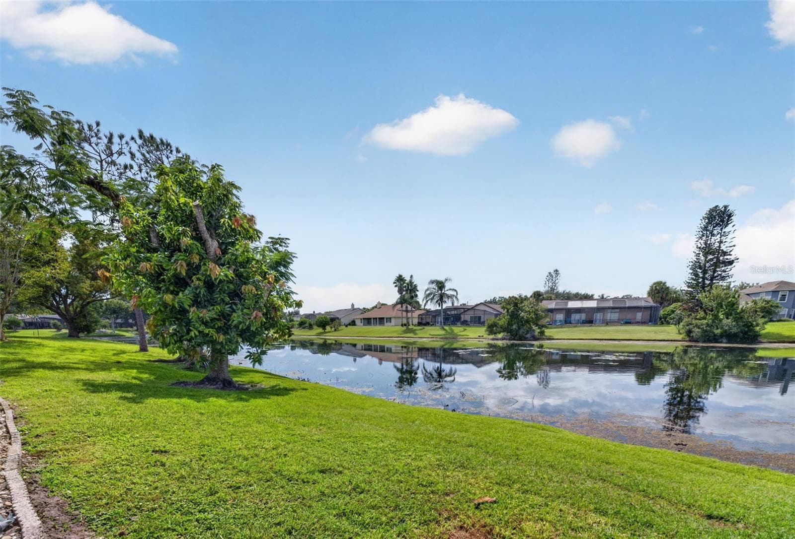 The back of the home features 75 feet of shore along Eagle Lake. - 2925 EAGLE LAKE DR, ORLANDO