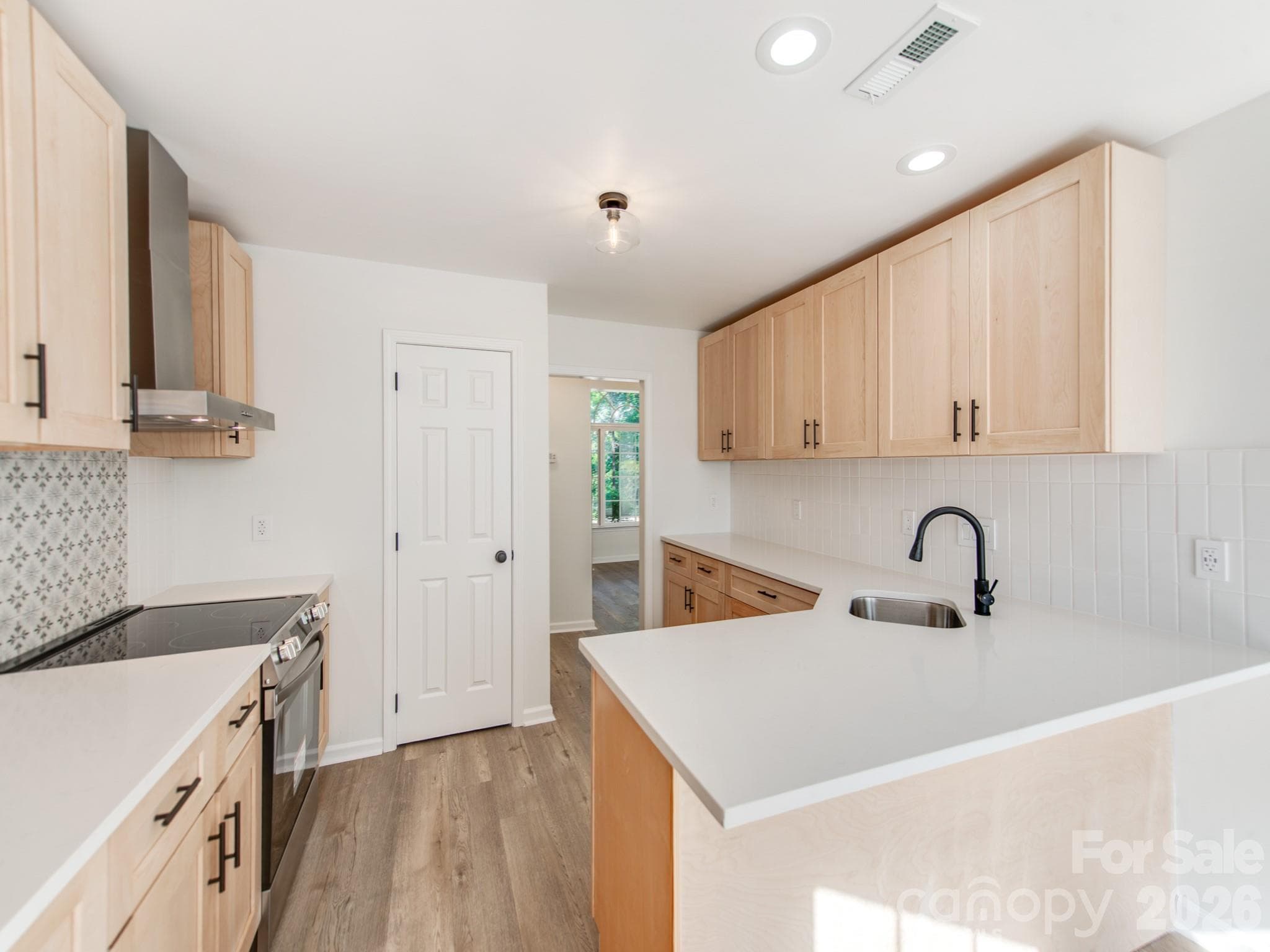 New Quartz countertops compliments the new cabinets. New faucet, sink, dishwasher,Stove - 810 Greenhill Drive, Charlotte