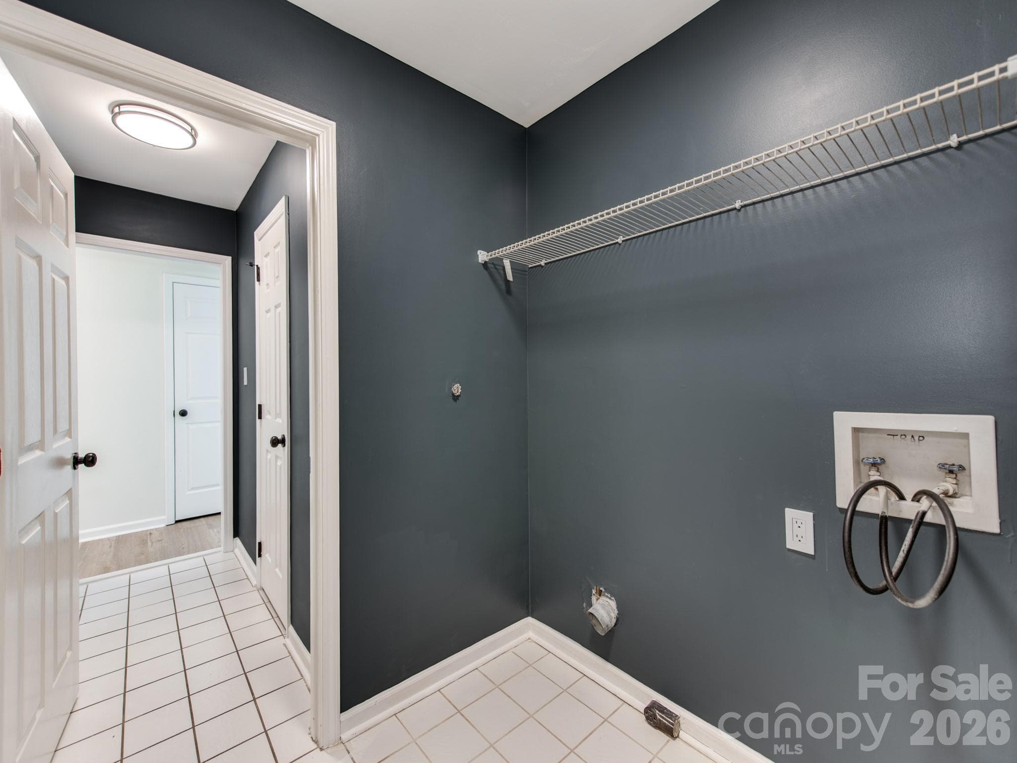 Laundry room includes a large storage closet - 810 Greenhill Drive, Charlotte