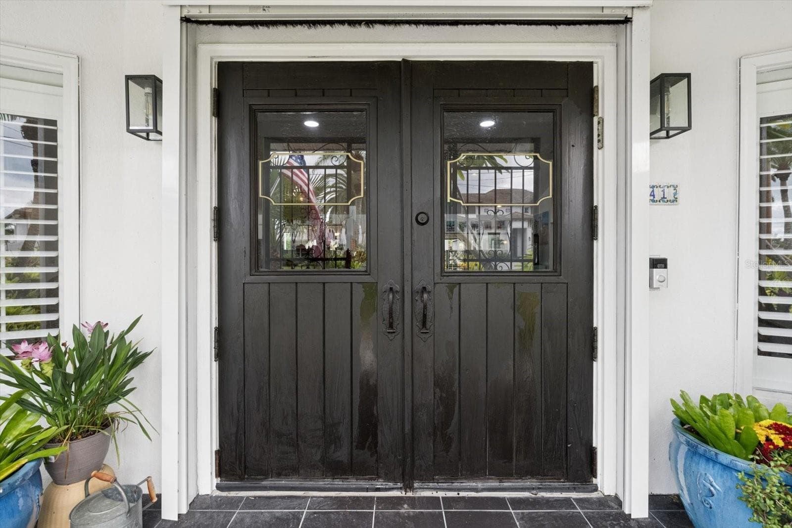 Front Door with automatic roll down hurricane shutter - 1741 STANFORD LN, SARASOTA