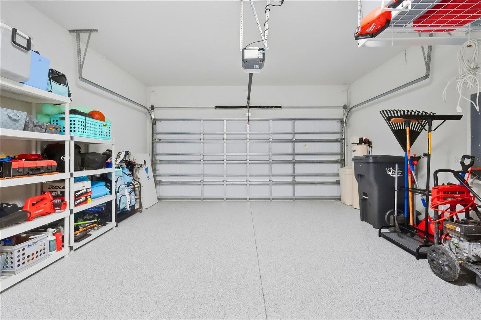 Garage with Storage Racks and Epoxy Floor - 11836 CATAWBA CV, PARRISH